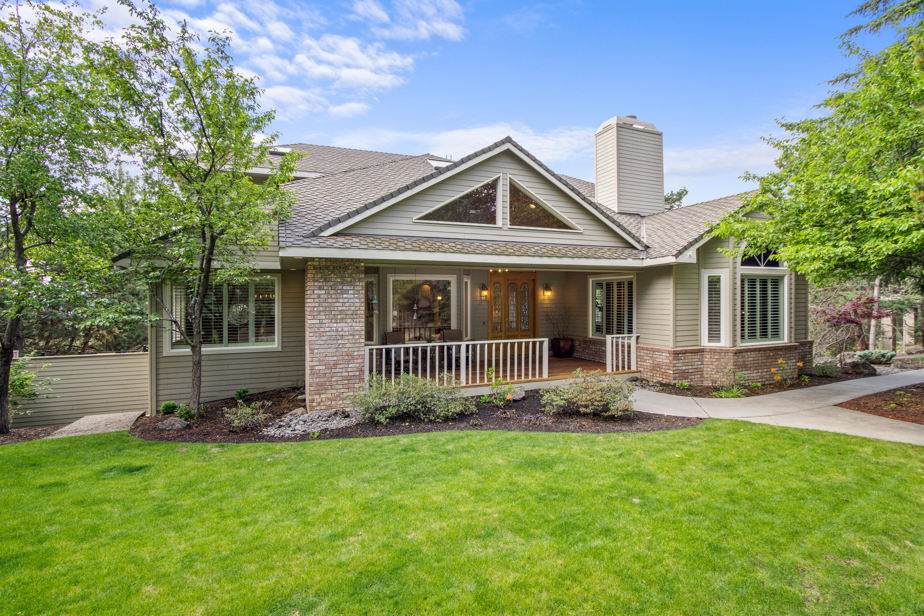 Desirable Awbrey Butte home that has a private & peaceful setting w/expansive City views. This luxury living retreat sits on a .96ac professionally manicured lot. Remodeled gourmet kitchen w/custom cherry cabinets, granite counters, lg center island w/prep sink & breakfast bar, SS appliances, dbl ovens, trash compactor, built-in refrigerator & wet bar. Kitchen adjoins greatroom w/easy access to the 1200sf wrap around deck. Spacious master suite w/relaxing sitting area to enjoy the views & a spa-like master bath that features a see-thru fireplace, jetted tub, full walk-in tile shower, custom cabinetry & dual vanity.  All 4 bedrooms are en-suites, 6 baths (4 full - 2 half), formal dining & living area, den & bonus/exercise room. Vaulted & high ceilings, 3 FPs, HW floors, Control 4 smart home sys or use your cell to control, multi-room audio, HVAC, security system, tv's & heated driveway. Home office w/built-in cabinetry & private entrance. 3 car garage w/shop area & ample storage space.