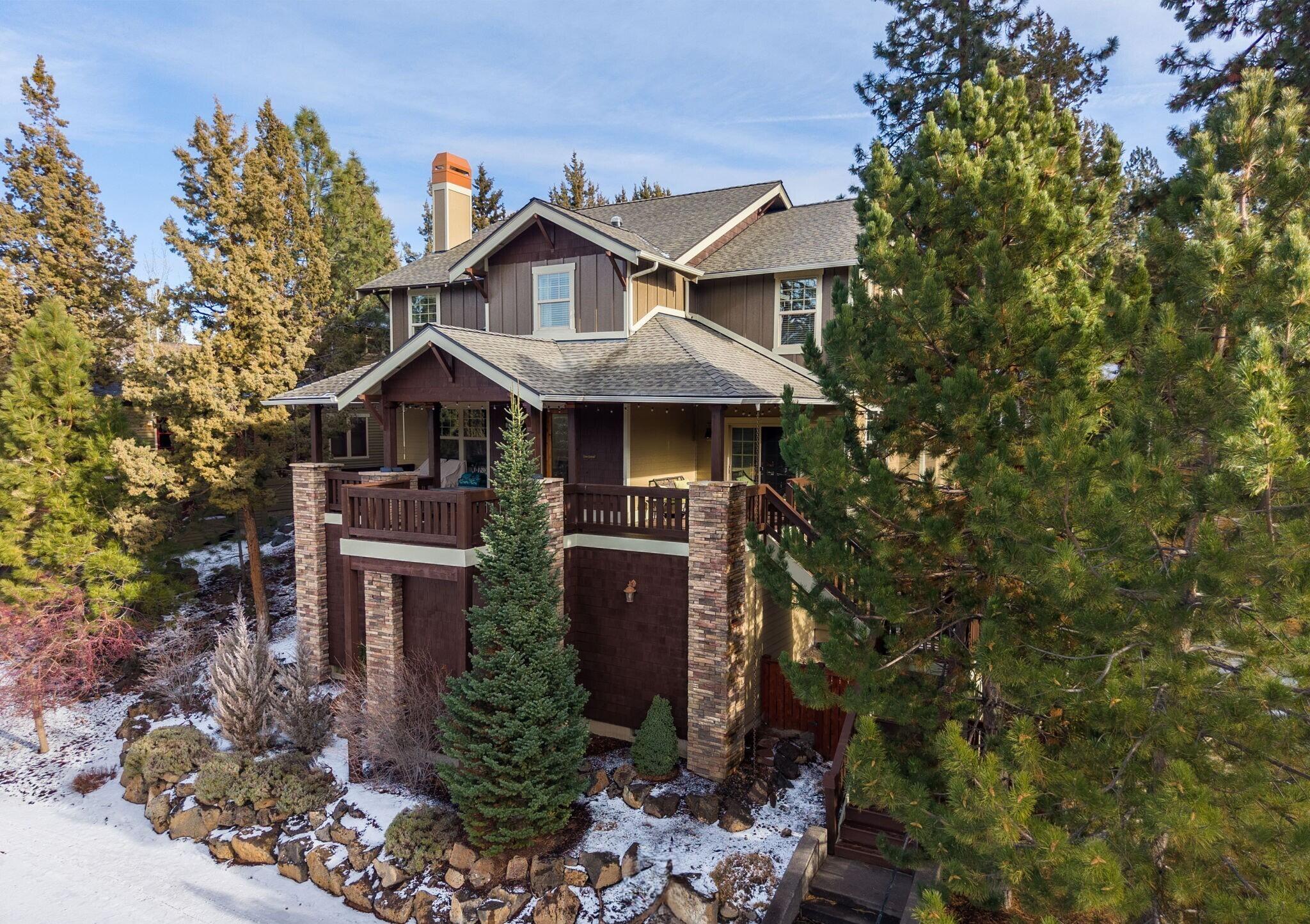 Nestled in the Enchantment community of Bend's luxurious Westside, this Northwest Craftsman style home offers main-level-living and wonderful views. Across the street from the Deschutes River with close access to the river trail, the main level has beautiful hardwood floors, primary suite with spacious bath, tiled shower, soaking tub, chef's kitchen with large island and Red Oak cabinetry, half bath, plus interior stone walls and hand-troweled walls. Built for entertaining, the covered decks create ample outdoor living space with great views of the neighborhood forest. Upstairs is a large loft for second living area, two beds, full bath, office/den. Adjacent to the property is a common area that provides nice privacy. Oversized two car garage, central vac, fenced exterior, and the large storage space under home is a must-see. New roof, exterior paint, and carpet in Fall 2024. Rare to see a home for sale in this small, peaceful community. Contact us to arrange your private showing.