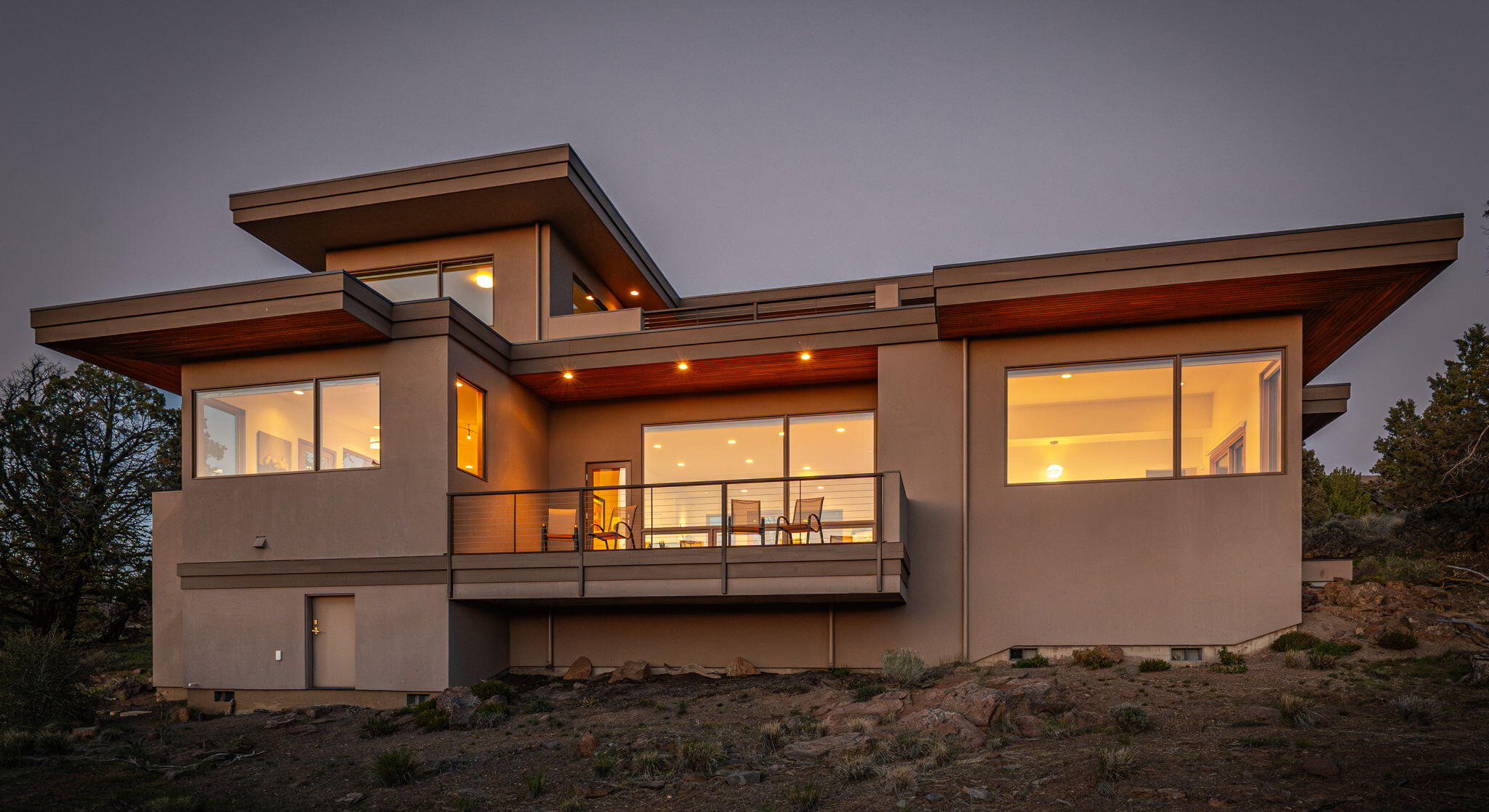 Enjoy captivating 9 mountain views framed by large picture windows throughout this stunning custom home designed by award winning Bend architect Al Tozer. Set high atop greatly sought-after Mariposa Lane, the open floor plan, high ceilings and expansive windows bathe the home with natural light. Multiple decks invite you to experience outdoor living at its finest. Set on over nine acres of beautiful desert scape with countless ghost trees, the topography is nothing short of breathtaking. This Tumalo property is centrally located affording a short drive to Bend & Sisters. The main floor's spacious layout highlights the primary bedroom suite with a soaking tub for relaxing while enjoying the mountain views. The upstairs features a large bedroom, and versatile bonus room both adjoining a deck with stunning views. This home welcomes all to be revitalized by the abundant natural beauty it graciously highlights making it the perfect place to live and share with family and guests.