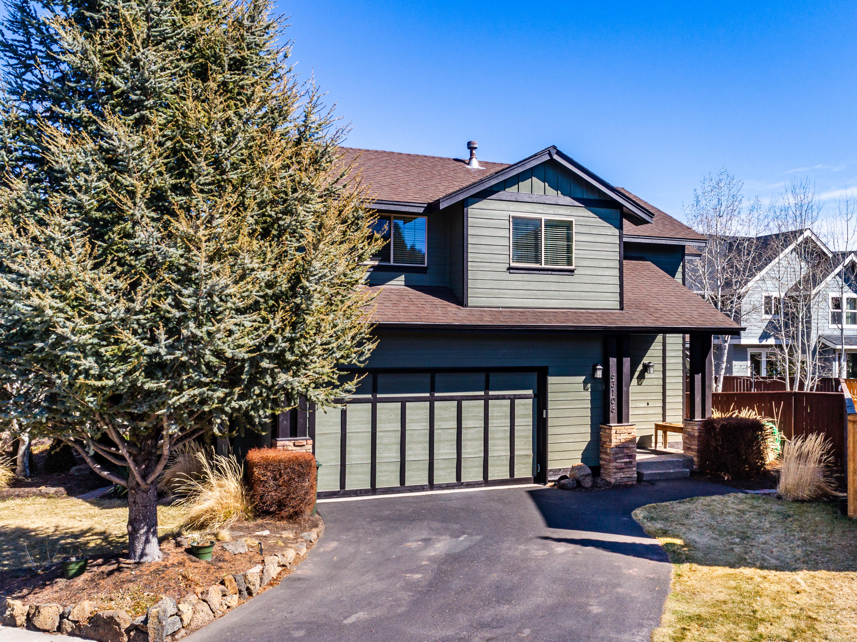 Welcome home to 63106 Riverstone Drive! This NW Traditional style -two story home is conveniently located within easy walking distance to the Deschutes River, Deschutes River Trail & Sawyer Park, easy access to the parkway, downtown & more. This home features a great room floor plan perfect for entertaining.  The kitchen features granite countertops, subway tiled backsplash, a custom island along with stainless appliances & pantry.  The light and bright living room area includes a gas fireplace with a custom mantle and spacious dining area and slider to the backyard. Upstairs you will find the master bedroom with vaulted ceiling, walk-in closet and bathroom with tile flooring and double vanity. Also, two additional bedrooms, guest bath & upstairs laundry room.  New carpet and pad installed in 2019.  The backyard is fully landscaped and fenced with two gates, sprinkler system, two storage sheds, and courtyard patio perfect for outside entertaining. Great home in a great neighborhood!!