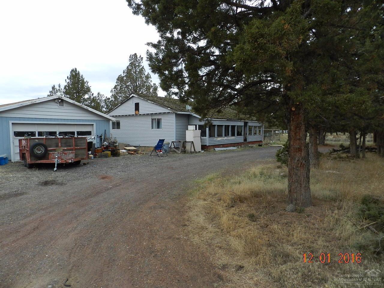 A true handyman special! Don't miss this opportunity to own an affordable small acreage parcel with a stick built home. There are plenty of out buildings for grown-up toys and projects as well as 4-H and hobby animals. including an over-sized detached 2 car+ garage with office or hobby room.