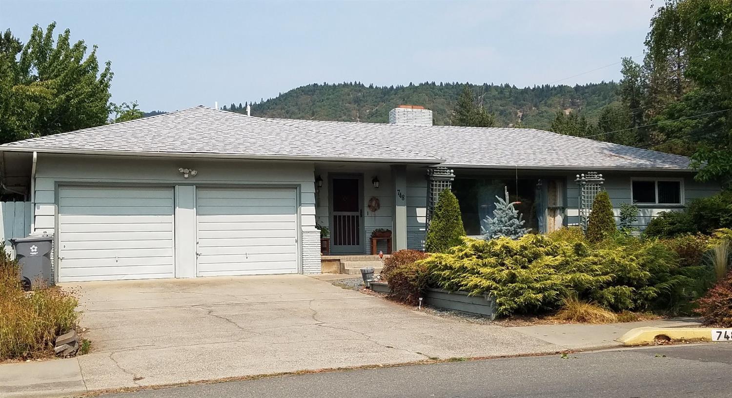 Charming home in nice NE Grants Pass Neighborhood, across from the Mormon Temple. Must see this 3-bedroom, 3-bathroom home; with hard wood floors in 2 bedrooms, living and dining rooms, tile in the kitchen and breakfast nook, wood-burning fireplace, large master bedroom walk-in closet with sitting area and much more. The low maintenance front yard is but the beginning...