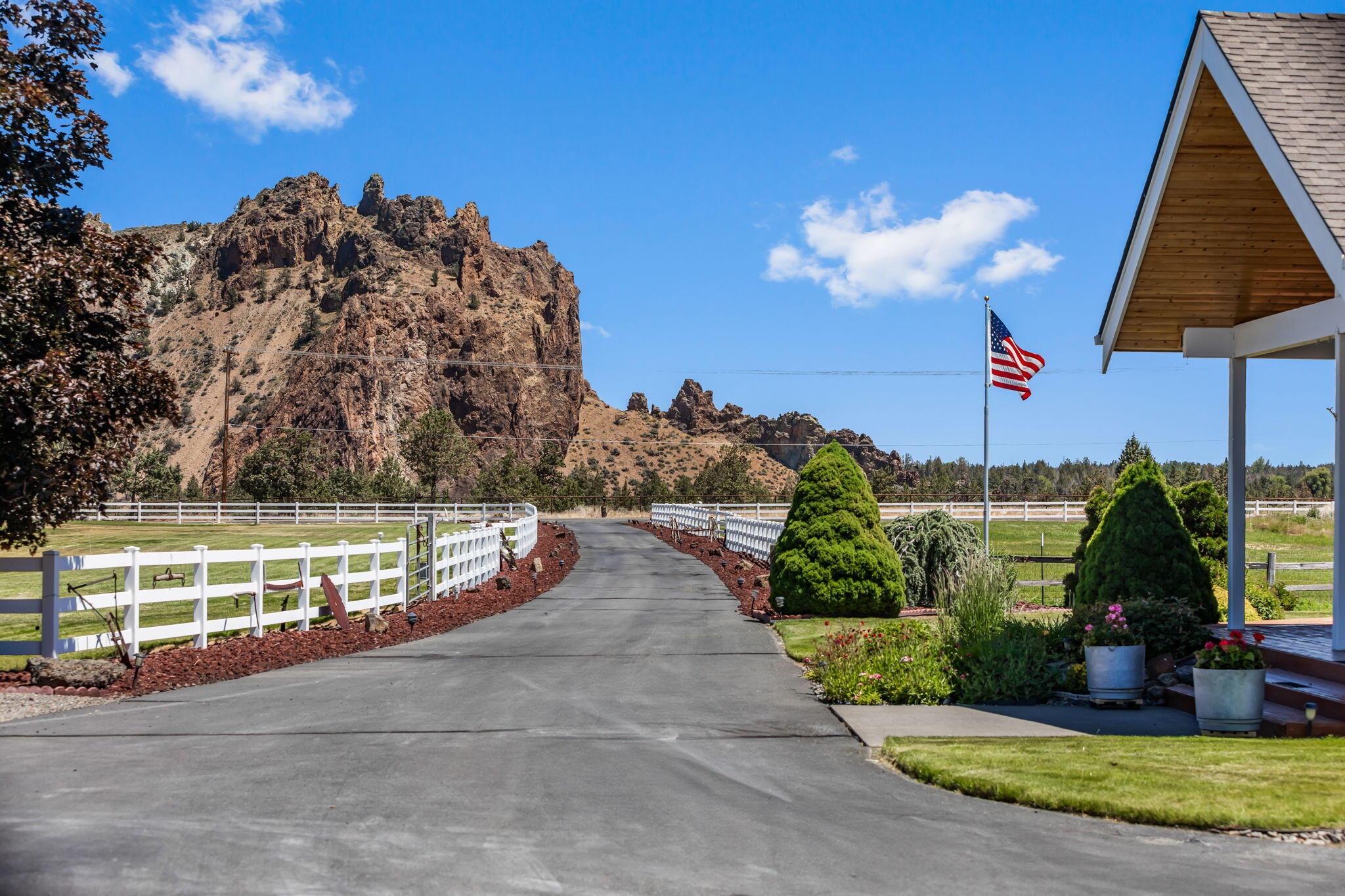 Price correction! Don't wait to see this fabulous Equestrian Estate!! Enjoy Smith Rocks from almost every room, while you look out over your beautiful pastures, complete w/large pond,  and relax while taking in the majestic views! 4 Bdr/2 Bath, with the 4th bdr. that can be a  bonus/hobby room, and an upstair loft office area.  Home features newer roof, paint, heat pump, both baths, dishwasher, LVP in 4th bdrm./bonus room, and so much more! 3 Car attached garage features a workshop area, 1/2 bath w/shower and utility sink. Detached 2 car garage has carpeted large loft area for hobbies, storage, rec room, etc,, 2 stall RV garage w/110 and 220, has shared space for horses/livestock,and office/tack. 3rd barn has covered feeding area, loafing shed and room for hay storage and cute tack room. Frost free faucets, overhead door and sliding door. Frost free faucets all around the property. 3 acres COI irragation. Irrigate from the pond. So much bang for your dollar! This will go fast!