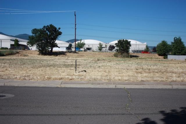 High visibility development lot on HWY 99 and South Stage Rd. High Traffic count. Prime commercial location. In Medford City Limits.