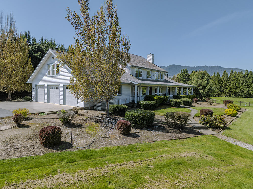 Exciting horse property on the Applegate River. Gated entry. Impressive 4400 SF custom home built in 2000. 3-car garage plus additional garage below caretaker's quarters. Open 4-stall barn w/storage & turnouts with shelters. Multiple pasture areas. Sand arena. Round pen. Covered RV parking. Area by the river has been parked out for relaxing. Irrigation rights from the Applegate River. This property is one of a kind. Call today for your personal tour, and welcome home.