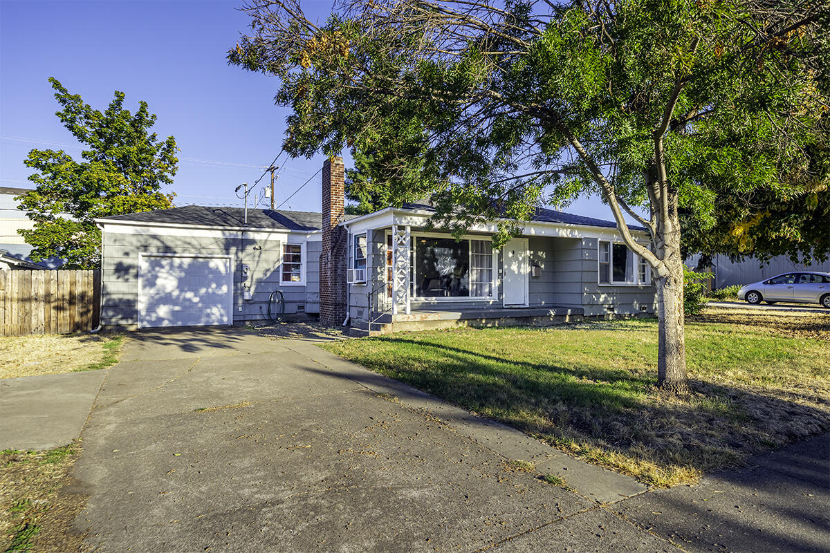 Location, location, location! Searching for a charming single level home close to everything Medford has to offer? If so, this is the one for you! Priced to sell, this property features 2 bedrooms, 1 bathroom (shower/tub combo), 1092 sq ft, spacious back yard, hardwood flooring, heated tile flooring in the large kitchen, tile countertops, single car garage w/ new garage door, rear & front porch, woodburning fireplace, & much more! Over the last 5 years, sellers have done tasteful updates such as updating the light fixtures, ceiling fan, electrical panel, hot water heater, and various other touch ups! Perfect opportunity for anyone looking for a low maintenance property with so much to offer! This one won't last long on the market, so contact your agent today for a personal tour, before its too late!