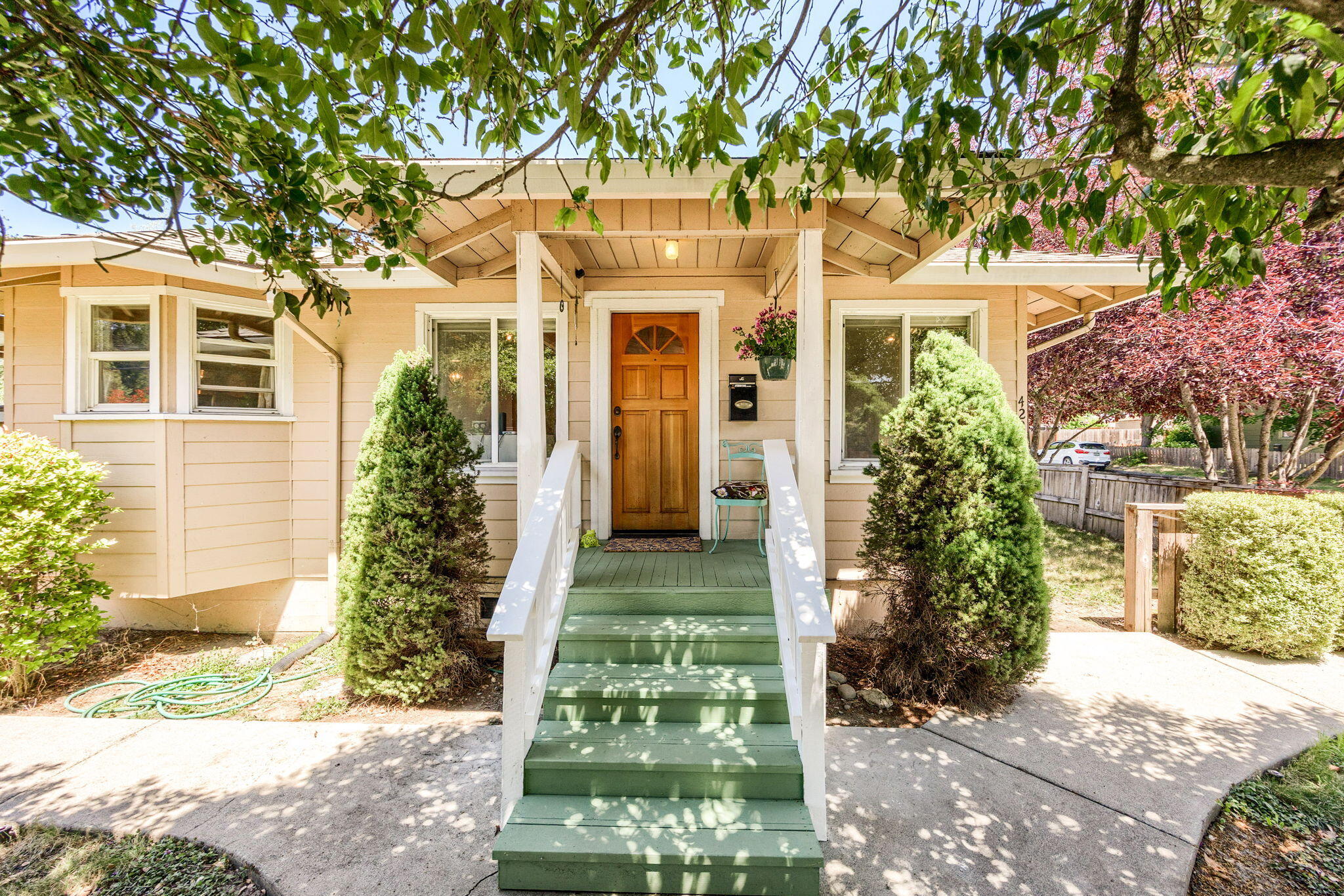 Charming 860 sq. ft. 2-bed, 1-bath bungalow built in 1947 with an open floor plan perfect for relaxing or entertaining. Features an updated bathroom with custom tile shower, spacious backyard with large concrete patio ideal for gatherings, and beautiful mature trees providing privacy and shade. Convenient street parking available and gravel driveway. Well maintained home full of character, located in a neighborhood close to shopping, schools, and amenities. Don't miss this cozy, move-in-ready gem!