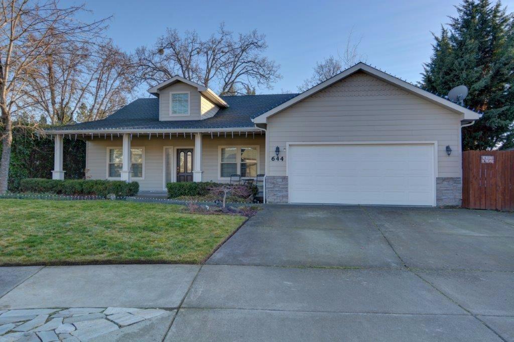 Elegant home near the Eagle Point golf course. Vaulted ceilings with a large open floor plan. The kitchen opens to the gorgeous living room, dining room and the great family room which flows out to the wrap around patio. The large back yard has plenty of shade and parking on the side for toys inside the gate and additional RV parking outside the gate. A garden shed completed the yard. A very quiet street and gracious curb appeal brings you in to the main living area. The kitchen has an island in the midst of the open floor plan.