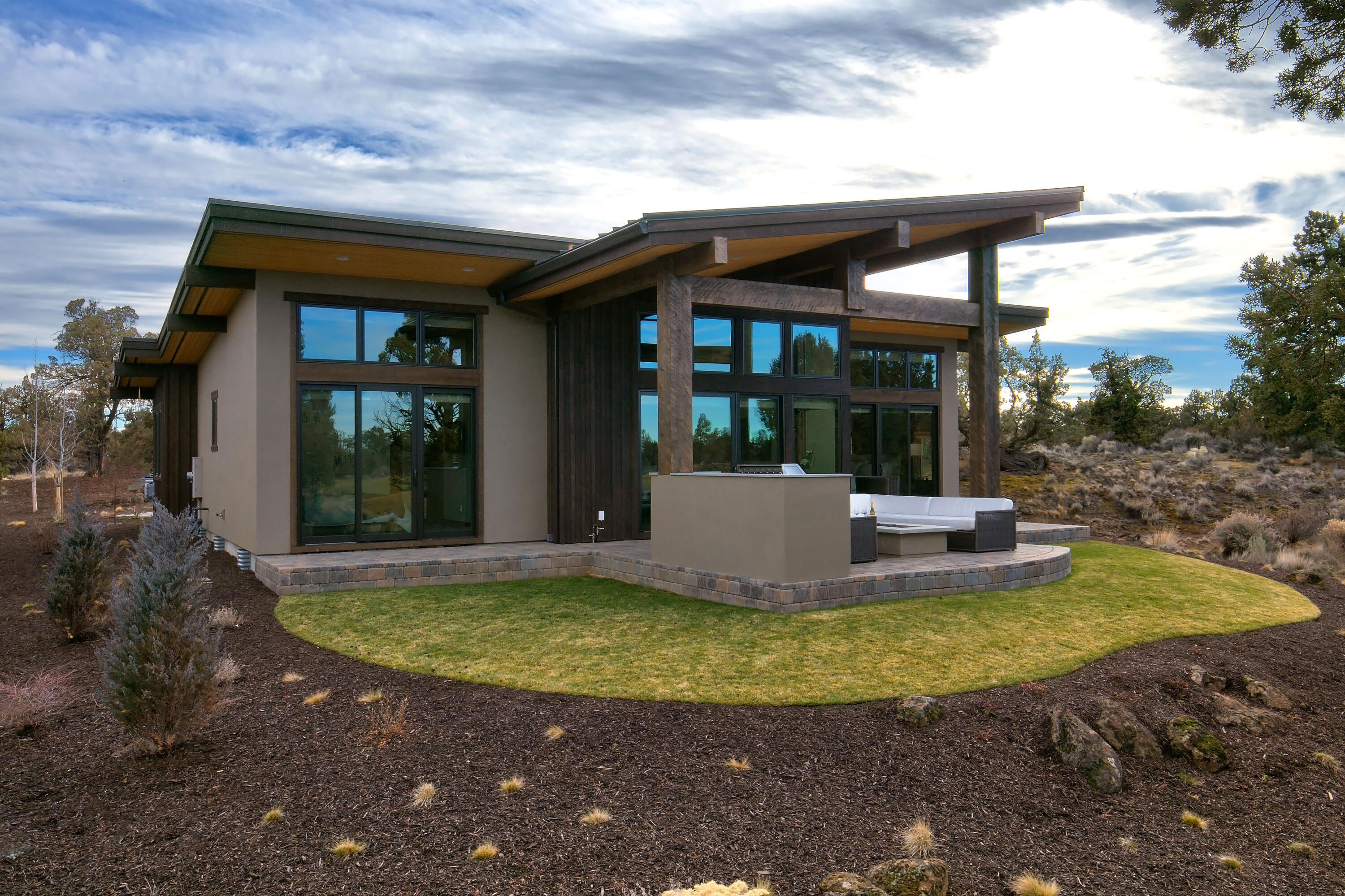 This Pronghorn home is located along the coveted 18th hole of the Tom Fazio Championship course at Pronghorn. It takes in tranquil views of the fairway and distant mountains and is also just a short walk or cart ride to the resort core and all of Pronghorn's amenities. Relax under the large covered paver patio, complete with Firepit and built in BBQ.  Newly completed in 2018, this home features a chefs kitchen complete with 36'' gas range, concrete countertops and a wine refrigerator. There are 2 primary suites, and a spacious 3rd bedroom and full bath. This beautiful homes lives on one level with the added bonus of a finished loft space, and has a full 3 car garage for all of your Central Oregon gear. The homesite is a generous .33 acres in size. It can also be rented short term. A Pronghorn Club Membership is included in the purchase. Ask for details!