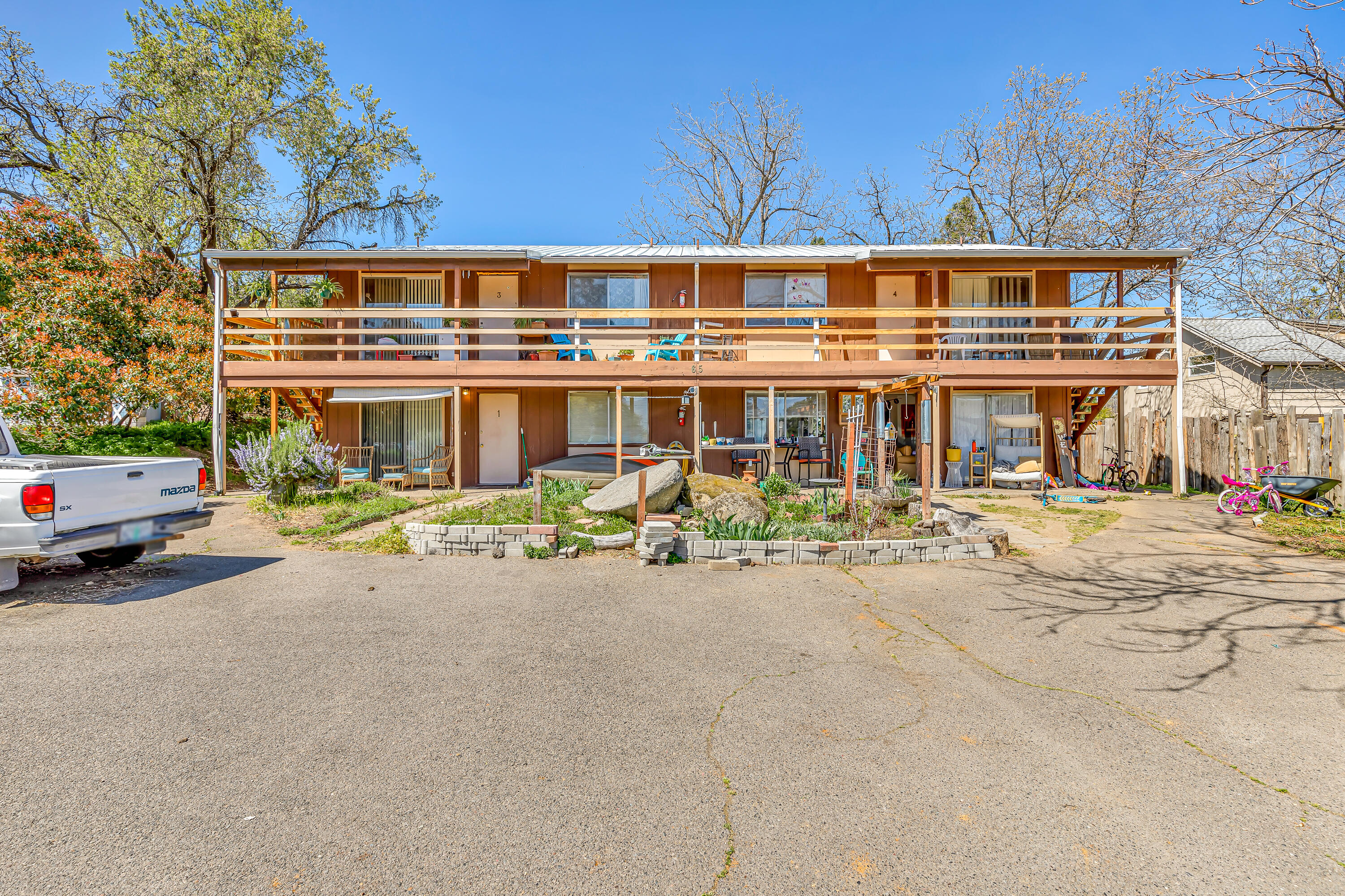 Attention all investors and individuals seeking a unique four-plex opportunity! This exceptional multi-family residence is located in the Ashland neighborhood and offers spacious two-bedroom, full bathroom units. Each unit, approximately 856 square feet, includes a kitchen with a range/oven, range-hood, refrigerator, a living room, in-unit laundry room with washer/dryer hookups, & a linen closet. Additionally, there are dedicated storage sheds (approximately 4x4x10) at the rear of the property, along with private off-street parking for both tenants and guests. The roof was replaced in 2004, and the property is built on a slab foundation, with all units having separate electric meters. This convenient location is just half a mile from downtown and only a few blocks away from local markets, restaurants, and shops. Currently, all units are leased on a month-to-month basis to qualified tenants with excellent payment history. The monthly lease includes owner-paid water, sewer, and garbage.