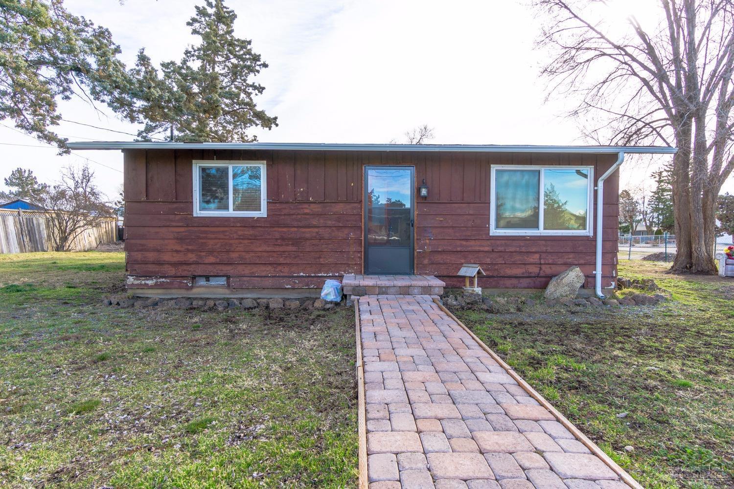 Perfect opportunity for someone with a vision! This charming bungalow style home has tons of potential to be beautiful again. Spacious kitchen w/newer Hickory Cabinets & plenty of counter space & storage. Dishwasher, refrigerator & glass top range. Full bath was just updated 2 years ago! Oil furnace heat, newer vinyl windows & insulated doors. All situated on a large corner lot w/RV/toy parking. Close enough to Redmond & major amenities while still maintaining small town feel. Home sold as-is.