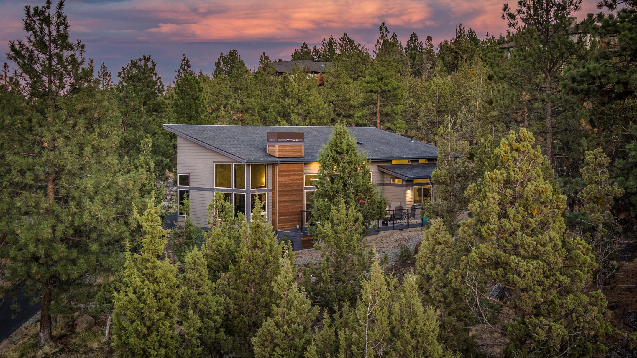 Expansive Cascade Views from this luxurious 3-bedroom + den, contemporary, custom home on Awbrey Butte. 50 wood wrapped windows, 13 foot ceilings, 4th bedroom is an office w/cut out for closet for 4th bedroom.  Home has music insulation throughout.  Windows have UV coating to protect hardwood floors. Very private setting.  3 car garages/extended length w/storage shed behind garage.  Basement has on demand water heater, heating system and storage, currently storing wine!  Art Gallery entry way, custom interior doors, chef's kitchen with quartz counter tops.  The Guest en-suite has full shower with custom shower doors as does Master Suite with shower and tub (separate but inclusive) w/desirable custom glass and tile work.  Master Bathroom backlit mirror + lighted makeup mirror + extras. Landscaping includes irrigation in zones closest to the home with native plants on exterior zones.  Waterfall with pond near entrance of home & courtyard. .81 private acres in highly desirable Awbrey Butt