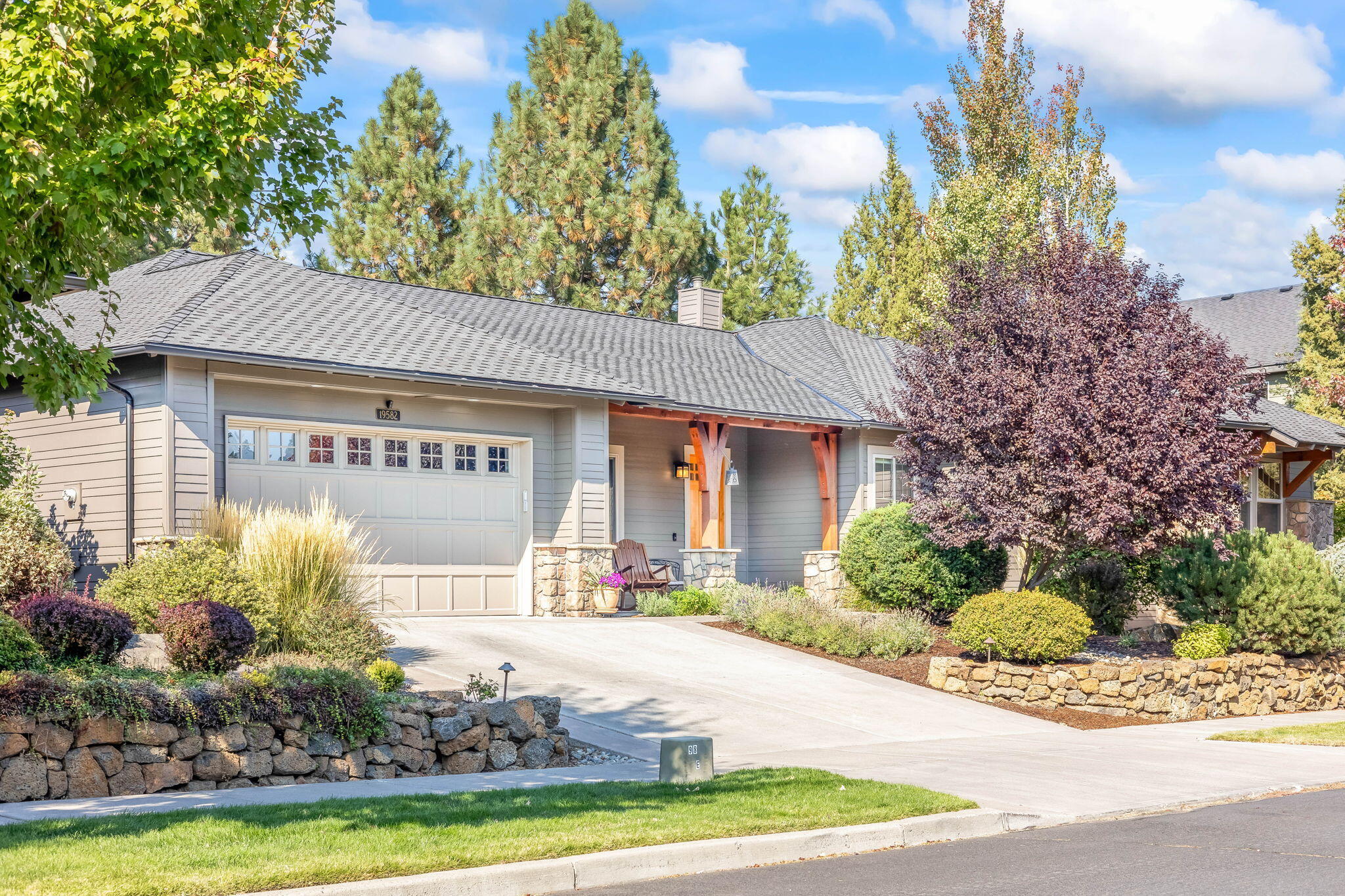Nestled on a peaceful .40-acre lot along the canyon rim, this stunning single- level home offers a perfect blend of comfort and nature. The great room, with built-in cabinetry flanking  the fireplace, features large windows that flood the space with natural light. Sliders from both the dining area and primary bedroom open to the beautifully landscaped backyard with canyon views. Step outside the the expansive patio, complete with a built-in BBQ and gas fire pit for entertaining. The kitchen boasts a breakfast bar, dining area, and a formal dining room just off the foyer, adjacent to the kitchen- perfect for hosting or as a home office. The thoughtfully designed floor plan offers primary bedroom separation for privacy, while the guest bedrooms share a Jack & Jill bath. Residents enjoy access to community amenities, including a pool, tennis courts, clubhouse, fitness center parks, and river trails. A true oasis of Central Oregon living.