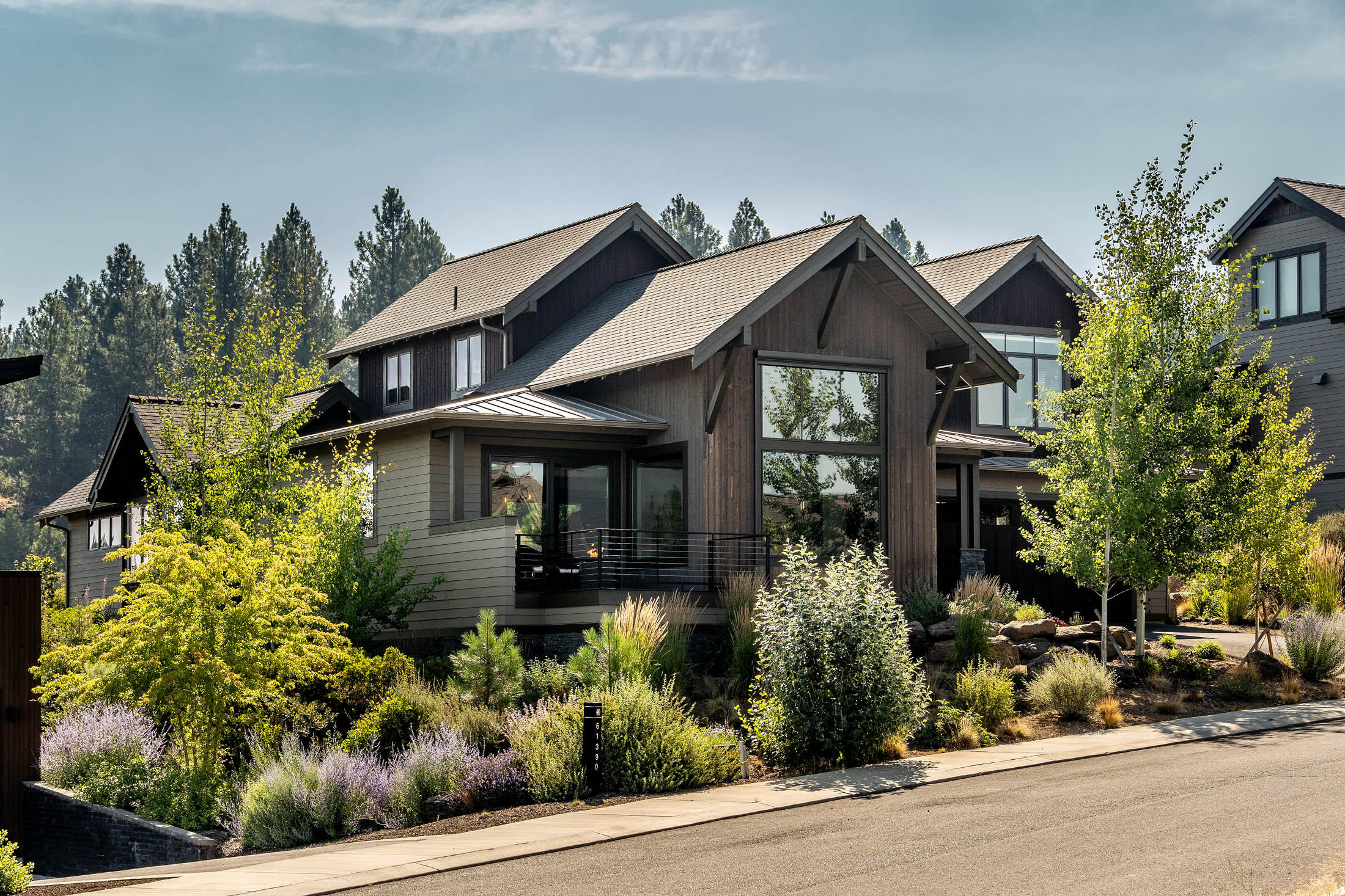 This gorgeous Northwest contemporary-style home, lightly lived in, with 4 bedrooms, primary on main floor, 3 bathrooms, in the desirable Tetherow community has Cascade Mountain views & plenty of privacy backing 14 acres, Alpine Park with trails.  Feel right at home with the open floorplan, large dining area with direct access to the private back patio, eye-catching interior finishes including solid surface counter-tops, large kitchen island, Thermador appliances, modern lighting & gas fireplace, large windows with tasteful window treatments, beautiful hardwood flooring, plenty of cabinets and drawers in the kitchen & primary bathroom with radiant floor heating, & lots of closets and storage space throughout the home.  Sizeable bonus room over-looking the open space & three bedrooms are upstairs.  Garage has workbench, cabinets & plenty of racks for your outdoor gear!  Tetherow offers access to two swimming pools, fitness classes, restaurants, 18-hole golf course, bike trails & more!