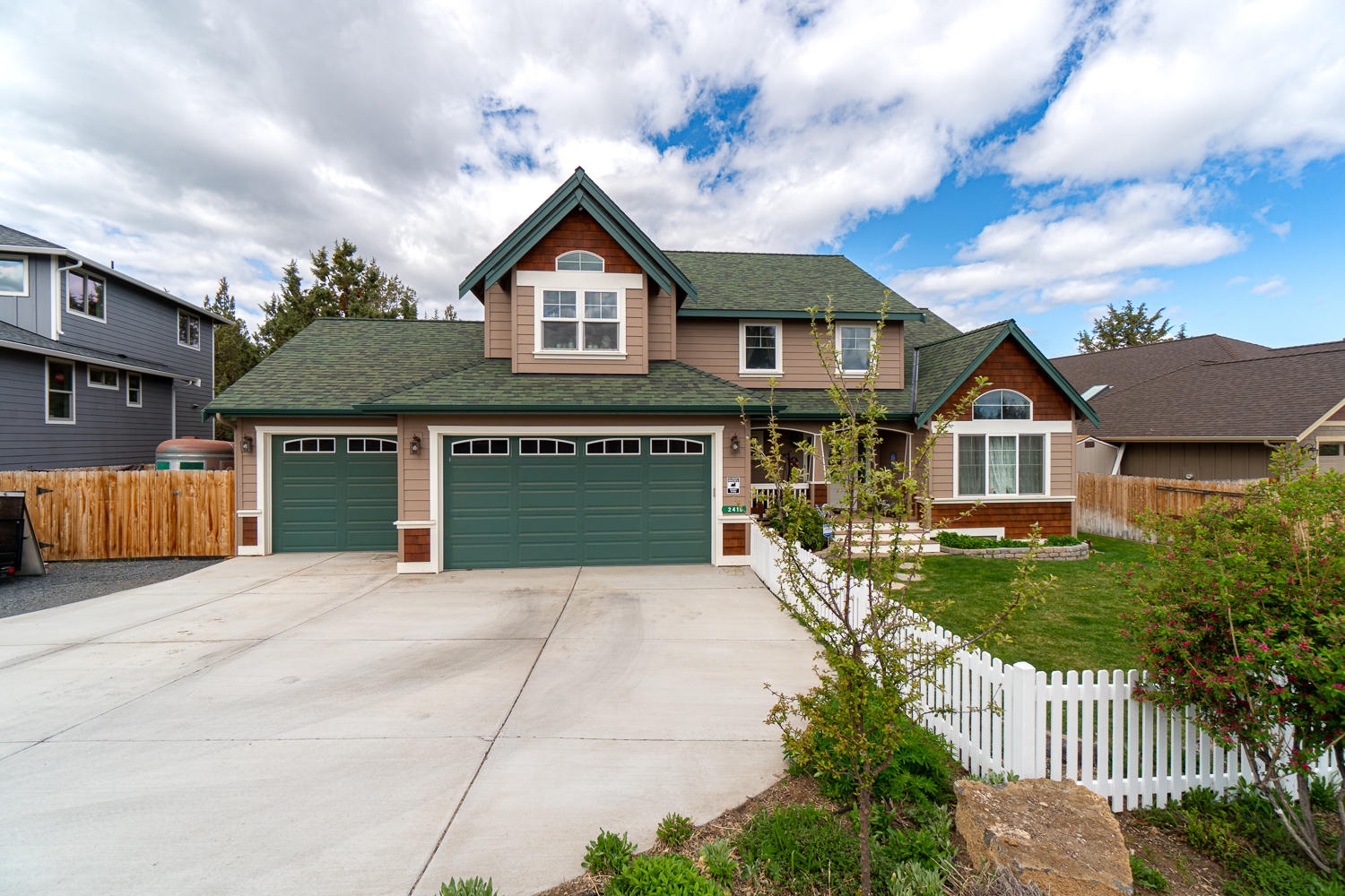 Nestled in the Holliday Park neighborhood in NE Bend, min to downtown & a quick trip to Bachelor or  Deschutes River! Beautifully landscaped & fenced front yard area leads up to an inviting covered front porch entry. Tiled entry w/bonus living area, den/office space. Great room layout offers a cozy gas burning fireplace & opens to eating area & kitchen w/ laminate barn wood look flooring. Kitchen ftrs a large central island w/ breakfast bar seating & pantry. Dutch door off the kitchen leads to formal dining/craft/4th bedroom w/french doors to the back deck. Primary bedroom offers a deck overlooking the backyard w/views of the fireworks at Pilot Butte. A Sunsetter retractable awning for yr round enjoyment too! Adjoining bath ftrs tiled dual vanity, soaking tub & tiled shower. Two addtnl bedrooms w/full bath & loft area upstairs. Back deck w/a privacy screened area w/hot tub & grilling area, landscaped w/raised garden beds, 6x8 & 11x18 sheds, RV parking & fantastic triple garage too!