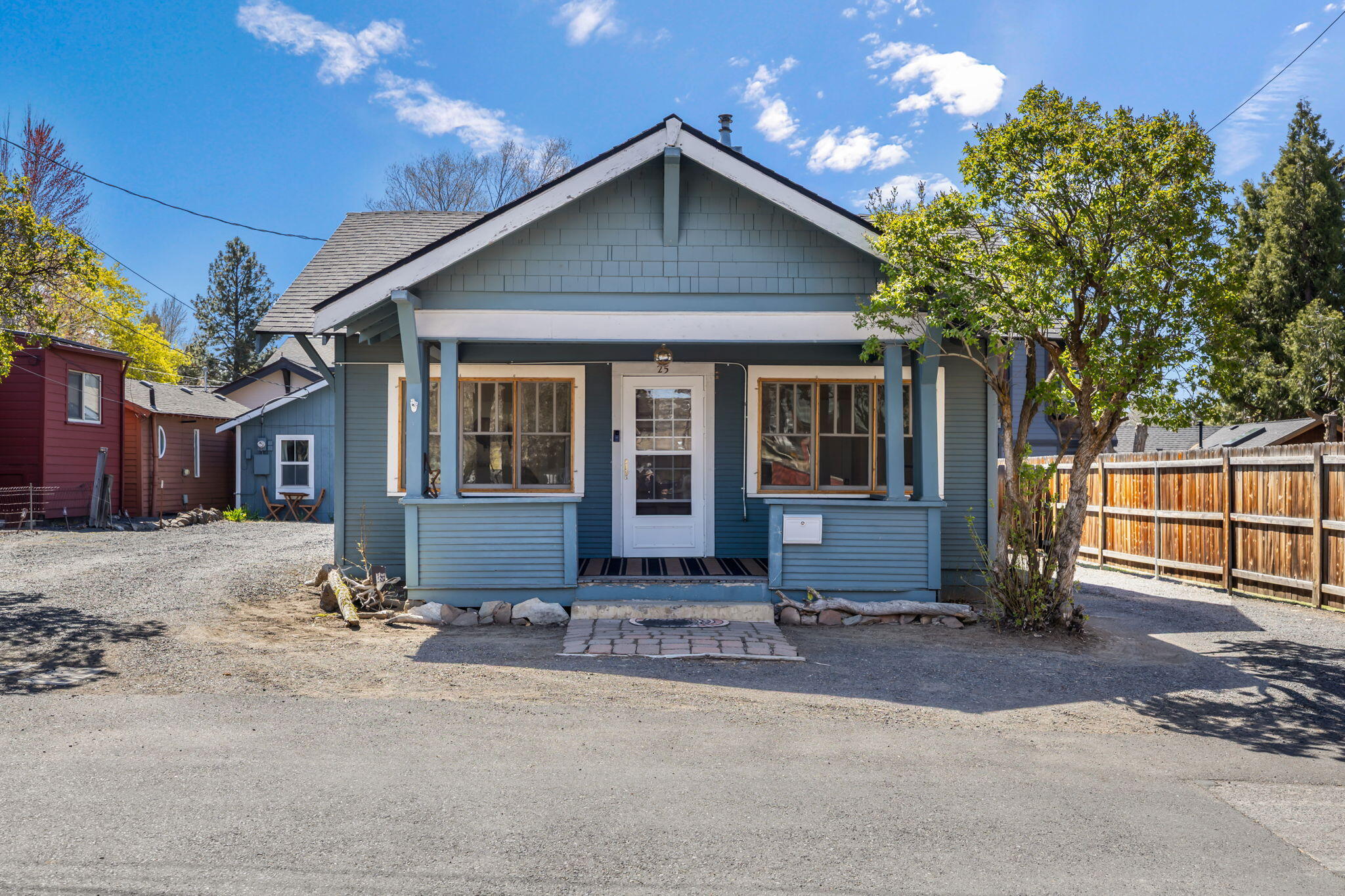 Step into the perfect blend of timeless charm and modern convenience with this 1918 Craftsman home, ideally located in the vibrant heart of downtown Bend. The main residence features 2 bedrooms, 1 bath and a laundry/storage room, showcasing classic architectural details. A detached studio-style ADU adds versatility, complete with its own kitchen, bathroom, and generous storage closet - ideal for guests, rental income, or a home office.

Set on a 0.14-acre lot, the property also offers exciting development potential. Just blocks from the Deschutes River, Old Mill District, local parks, and downtown Bend's mix of shops and restaurants, this home places you at the center of it all. Whether you're looking for a primary residence, an investment opportunity, or both, this is a rare gem that delivers on location, character, and future possibilities.