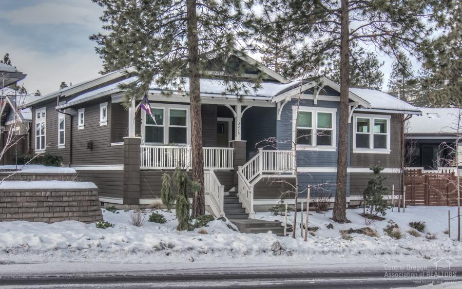 Newer one level NorthWest Crossing home. Very energy efficient & quiet: 8 thick walls, triple pane windows, mini-split heating/cooling, tankless hot water. Light & bright courtyard floor plan w/ wall of glass between island kitchen & private deck, large NWX yard w/ low maintenance landscaping w/ cool lighting & hot tub. Large master suite w/ huge walk-in closet. Unique wine bar area off cozy living room. Quality finishes throughout: concrete island counter top, hardwood floors. Lg 2 car garage w/ shop area