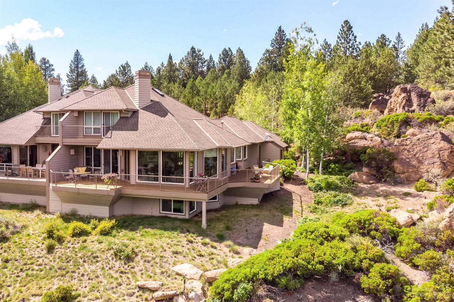 Stunningly majestic Deschutes River & canyon views abound in this highly sought after location in Mt Bachelor Village. This 3 story townhome offers 3 bedrooms, 2.5 bathroom, 2,716sf, & sits on a private bluff overlooking the river with a wraparound hard wood deck, offering ease & flow for entertaining as the river rushes by beneath you. The main level offers a vaulted great room, gas fireplace, updated kitchen with solid quartz counters, breakfast bar, ss appliances & walk in pantry. Main level master suite has a private deck & there is a 2nd master suite upstairs with private deck. Downstairs features a spacious bonus room, storage room/office or 4th bedroom with cabinetry and a huge storage closet. Abundant natural light throughout and lovely views from each level. Easy access to the river trail, Old Mill District and the road to Mt Bachelor. This is a very rare offering for one of the premier Deschutes River views in Bend. Well maintained and is move in ready. Welcome home!