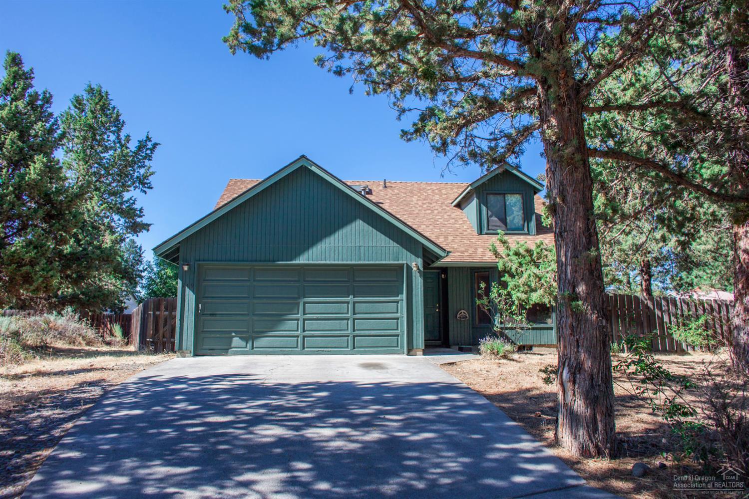 Lovely home perched on a slightly elevated south facing lot at the end of a quiet cul-de-sac in SE Bend. Rm zoned, 7,800 square foot lot with close-in location to schools, Reed Market Senior Center Park and Pilot Butte. Open floor plan with the master on the main and two bedrooms upstairs. Skylights and vaults give this home extra character! Updates include full sprinkler system, main level flooring, & interior paint. Attached two car garage with fenced yard and room for trailer/ RV parking.