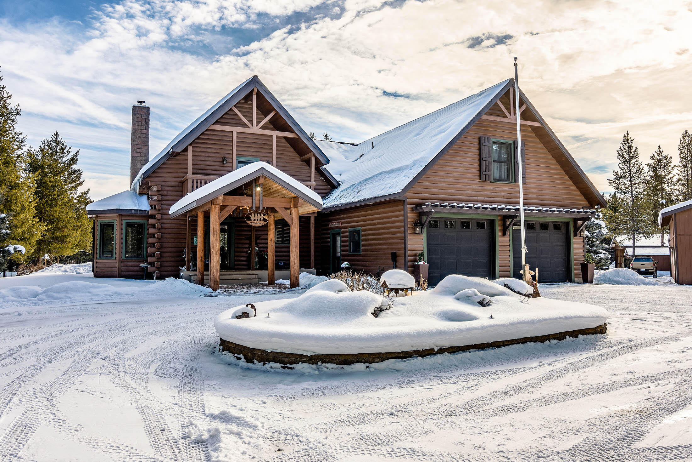 Beautiful custom built Lincoln Log home on 16.49 acres. Enjoy privacy & views of extensive landscaping that includes a 30' diameter pond & waterfall. The floor plan features a vaulted great room with a wall of windows that bring in the natural light, wood ceilings, wood burning fireplace with a custom Walnut mantle, radiant heated floors through out the main level. Spacious kitchen with granite countertops, stainless steel appliances, custom cabinetry & butcher block island that includes a nook area with built in china cabinet. There are 2 bedrooms down & 2 upstairs with a large family room and views of Paulina Peak. Attached 2 car garage. 30x40 heated stick built shop with RV door & a single car heated garage attached off the back. 24x40 covered parking area for utility trailers & equipment. No HOA or CC&R's