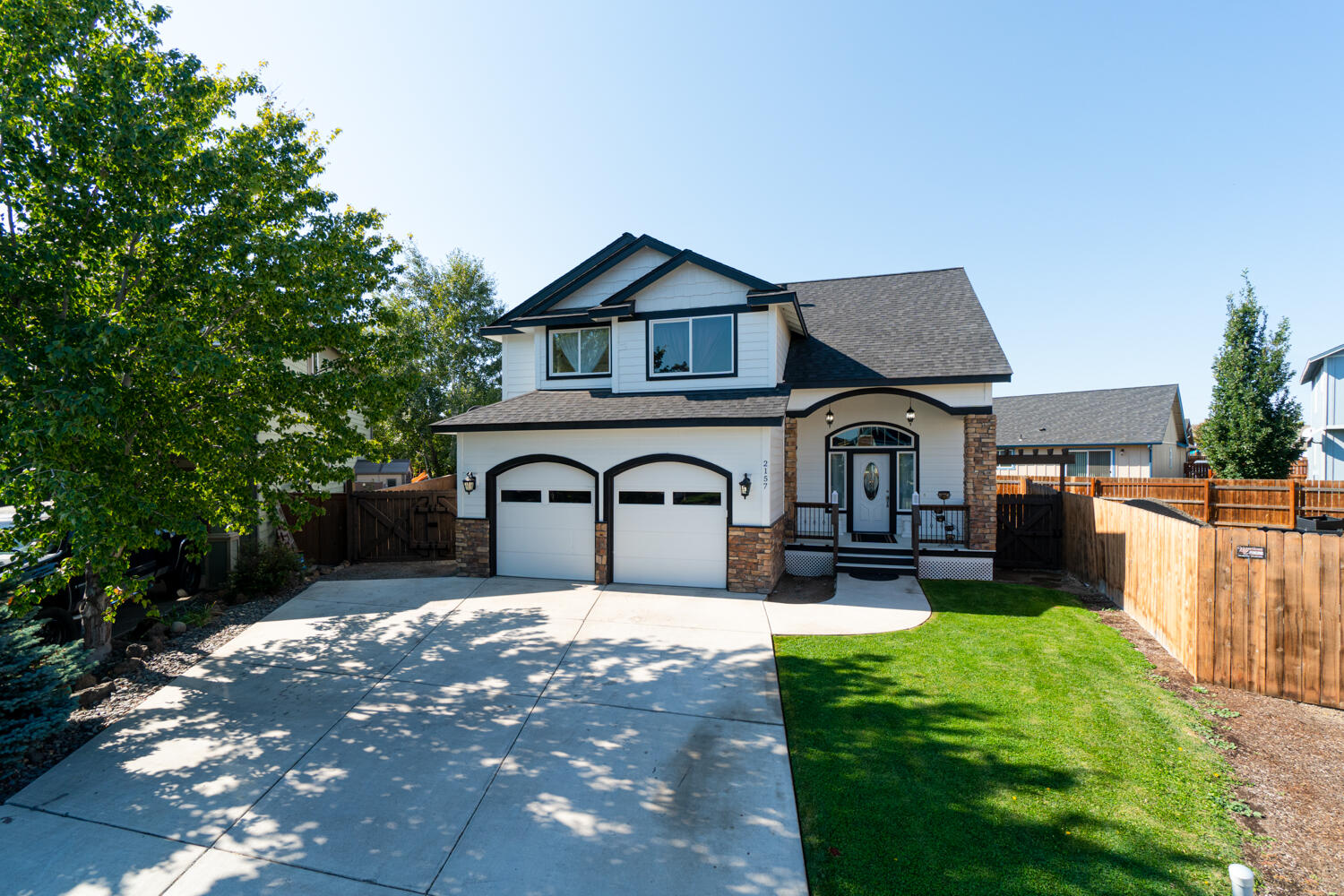 Custom designed, exceptionally well cared for, turn key home inside & out, offering fresh interior and exterior paint, newly replaced light fixtures & door hardware throughout, it also has slab granite counters with granite/tile splash & under mount sinks, central A/C, tile & laminate flooring, gas fireplace, cathedral ceiling in living room, finished garage, fire pit and a large lot offering RV parking, RV hookups and great curb appeal. Conveniently located close to highway & by-pass access, shopping and hospital/medical facilities. HOA fee covers sewer, irrigation water, domestic water and snow removal. HOA fee stated is an average and subject to change depending on water usage, etc.