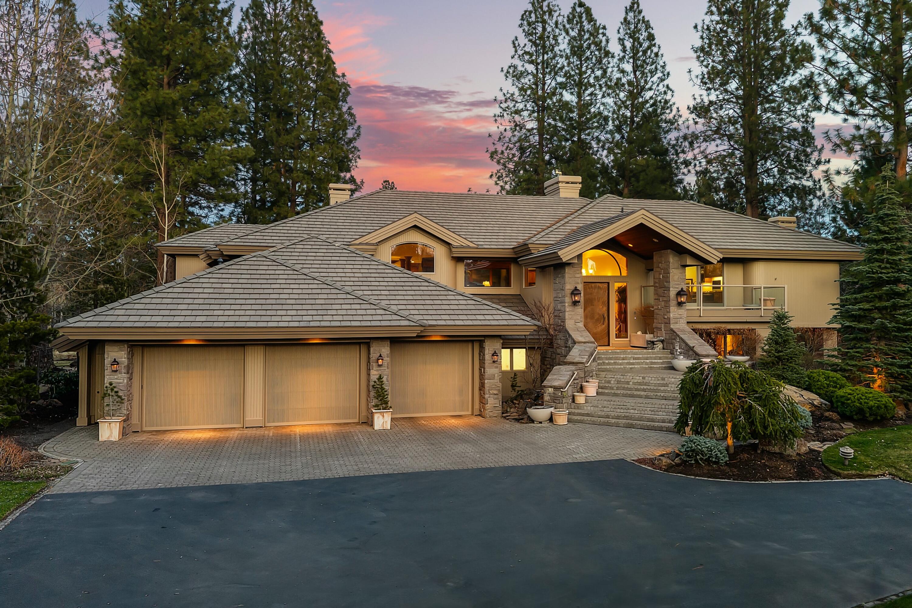 Located on a spacious, premier lot within the beautiful Broken Top golf community, this exquisite custom home enjoys a quiet, private setting with breathtaking views of a serene lake, alive with vibrant wildlife along the scenic 4th fairway. The welcoming interior is graced w/ an abundance of large windows framing the surrounding natural beauty at every turn. Designed w/an elegant ski chalet in mind the interior is warm & inviting w/ meticulous craftsmanship & attention to detail throughout, featuring hand distressed alder finishes, soaring vaulted ceilings, an impressive stone fireplace & a flowing open floor plan. The large primary suite boasts stunning views & is a peaceful retreat w/ a luxurious bathroom & an oversized closet. On the lower level you'll find a private guest suite, two Jack & Jill bedrooms, large family/media room & a mini kitchen offering comfort & privacy-perfect for guests or multi-generational living. Experience superior quality embraced by the beauty of nature.