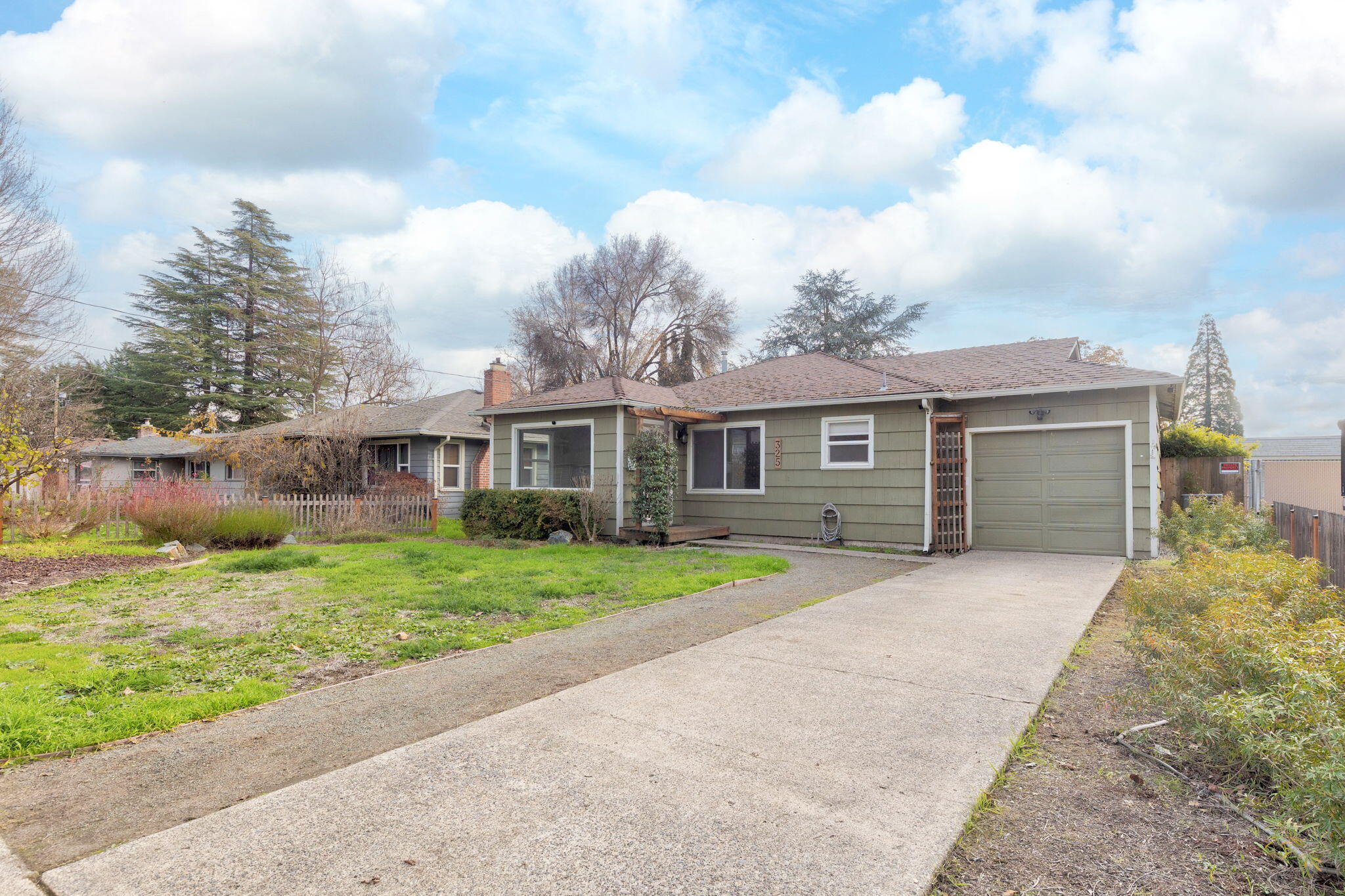 Vintage 1948 2-bedroom, one bath home on a level lot with large, fenced back yard in Northeast Grants Pass. The home offers the charm of the midcentury with modern upgrades including gas range, heat pump for heating and cooling, and vinyl framed double pane windows. The property is in a fantastic location, close to shopping, schools, city services, and easy access to I-5. This is a Probate sale and will not delay close of escrow.  Seller will consider backup offers