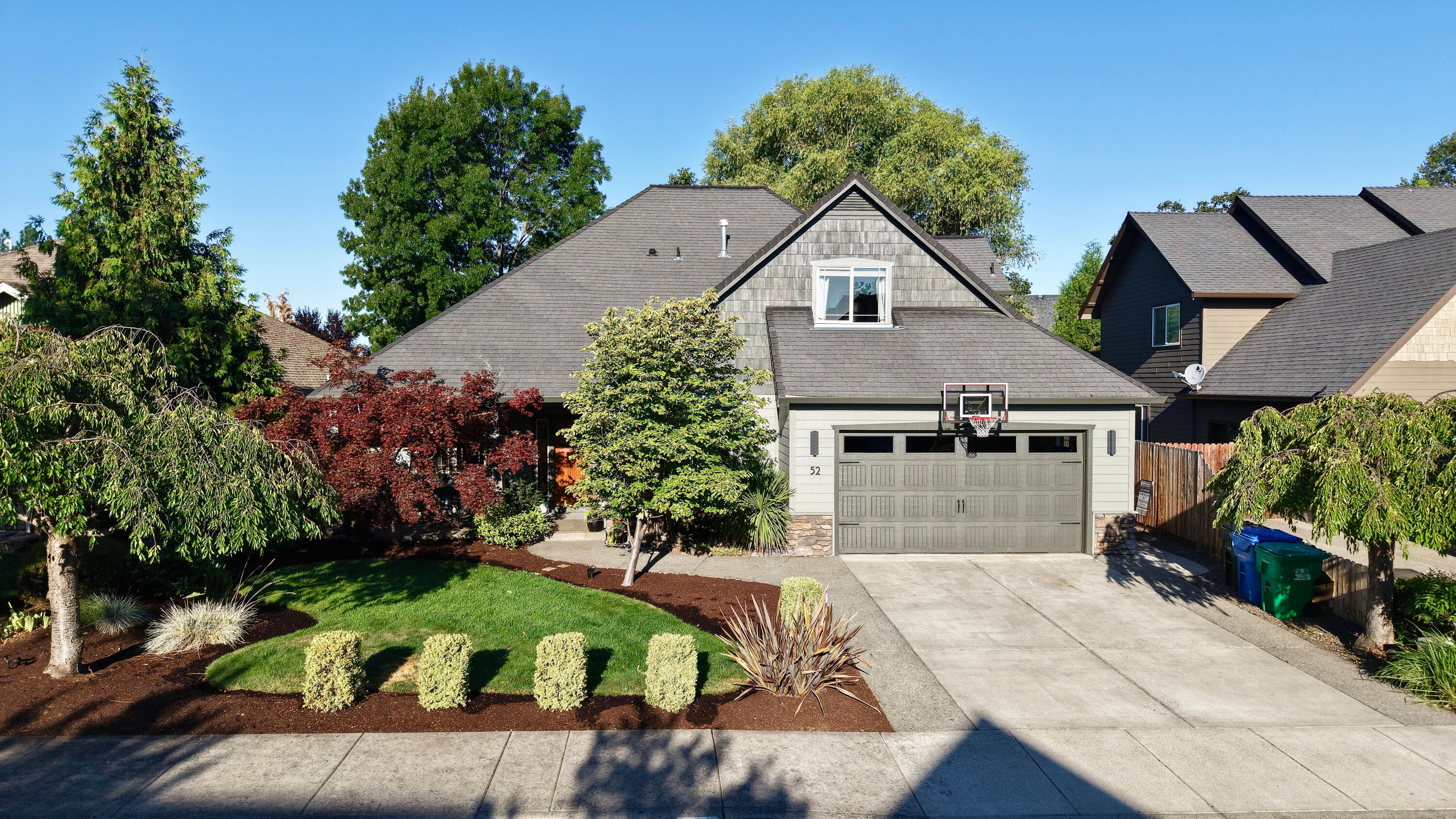Beautifully maintained two-story home located near the Eagle Point Golf Course in a quiet, established neighborhood. This 3-bedroom, 3-bath home offers 2,324 sq. ft. of comfortable living space with quality finishes throughout. Enjoy vaulted ceilings, hardwood flooring, a cozy fireplace in the living room, and a well-appointed kitchen with granite countertops and a gas cooktop. The spacious main-level primary suite features its own fireplace, two large walk-in closets, and a luxurious Jacuzzi tub. Upstairs you'll find two additional bedrooms and a full bath. An extra guest bath is conveniently located on the main level. The .24-acre lot includes mature landscaping, a fully fenced backyard, a covered patio for year-round enjoyment, and recent exterior paint for added curb appeal. Just minutes from the golf course, this home combines elegance, comfort, and location. Listing agent related to seller.
