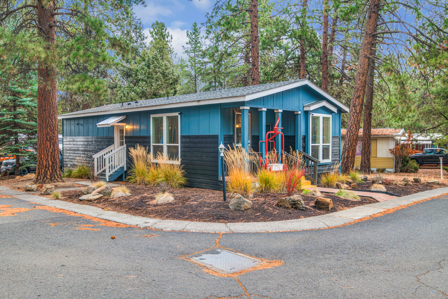 Welcome to this 2019 Energy Star Palm Harbor manufactured home, perfectly situated on a beautifully landscaped corner lot. Enjoy the convenience of being just minutes from the Old Mill District, nearby trails, the Deschutes River, and all that Central Oregon has to offer. This home features 3 bedrooms and 2 bathrooms, including a spacious master suite with a large closet and private bath. The kitchen boasts a pantry and a large island with a dining area that opens seamlessly into the roomy family room—perfect for entertaining or everyday living. Monthly space rent of $1,176 includes access to the community recreation room and newly renovated pool area. Please note, the sale includes the mobile home only; land is not included.
