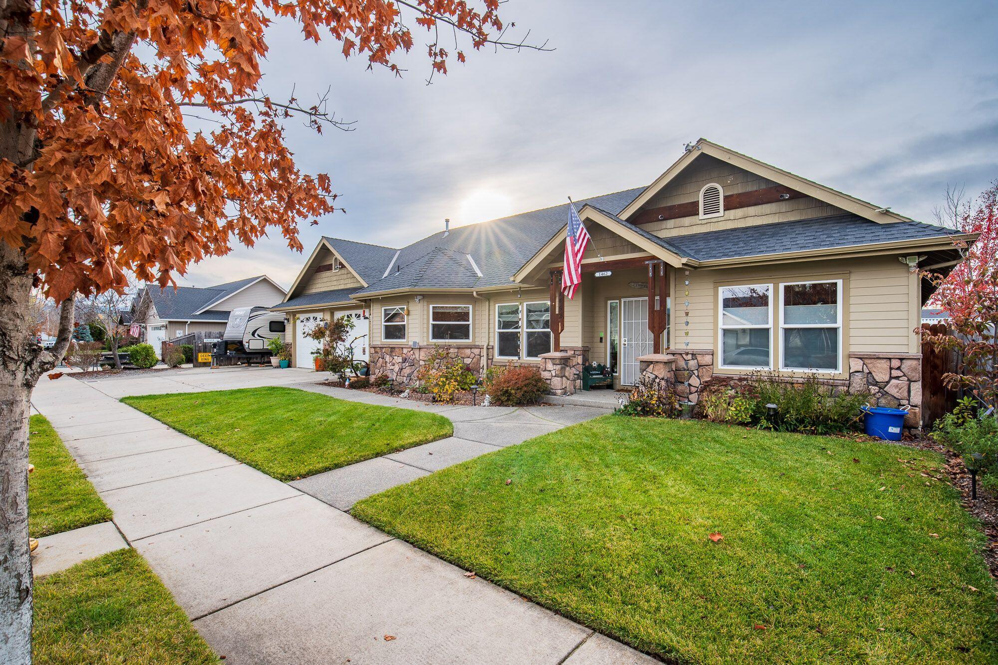 A cozy home with character!  This 2007 Northridge built home is single level and 1838sf, with 3 bedrooms and 2 bathrooms.  Welcome into an open concept living space with vaulted ceilings, hardwood floors, and a gas fireplace.  A gourmet kitchen fit for a chef boasts granite slab countertops, a gas stove, cherry cabinetry providing tons of storage.  Comfortable primary bedroom also has vaulted ceilings along with designer window blinds, and a barn door leading to en-suite bathroom with double vanity, jetted tub, and large walk-in closet.  Head outside for more great details such as a concrete patio perfect for entertaining, hot tub, and double car garage with shop space.  RV parking with full hookups.  Great curb appeal with over 150 tulips blooming in the spring!  Close to hospitals, shopping, and restaurants.  Be sure to add this one to your holiday list!