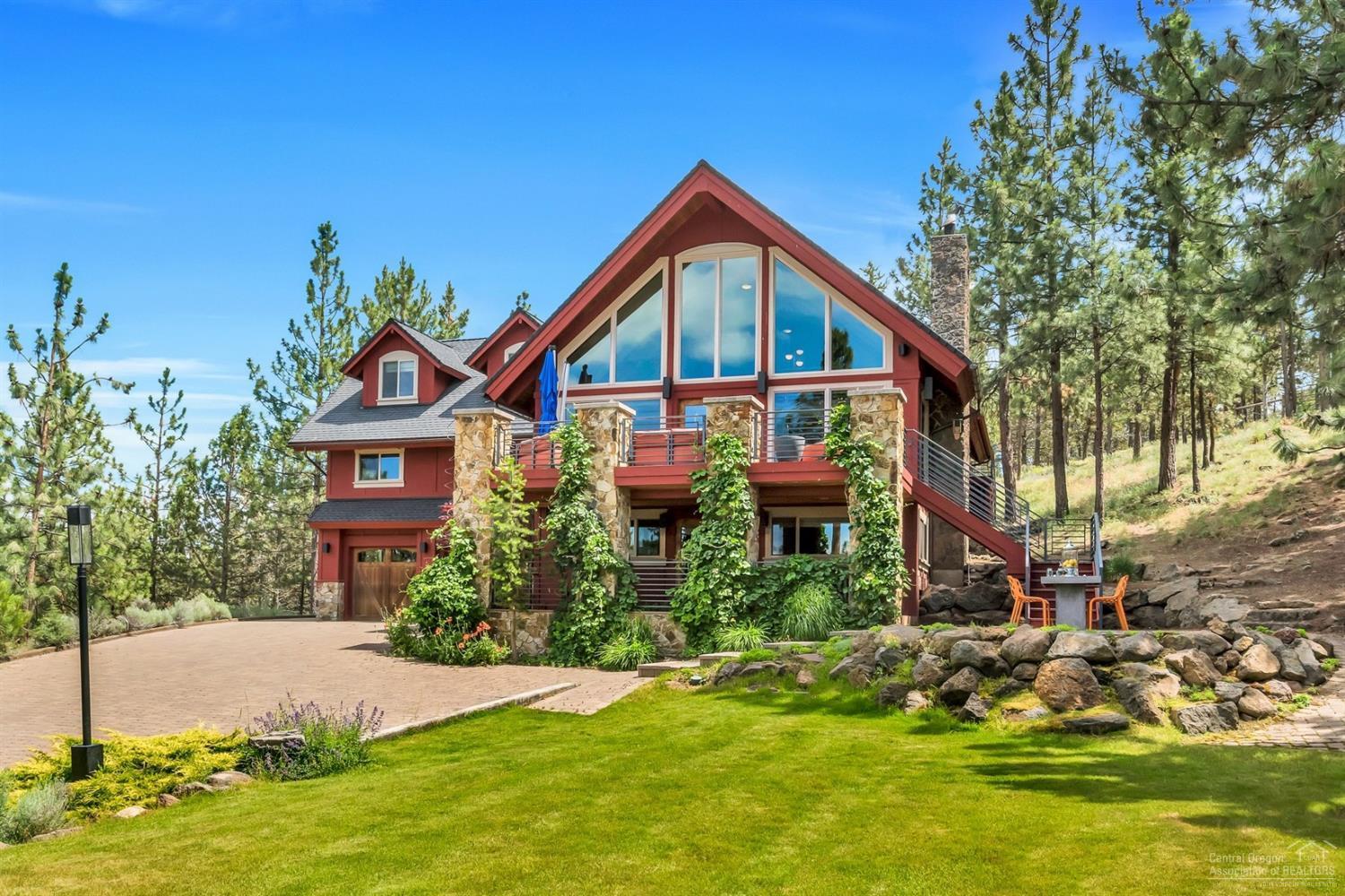 One of a kind Chalet mountainside home on over an acre! There are views for miles and every feature you could ask for with plenty of privacy. Home has a deluxe chef's kitchen with Viking appliances, new Bluestar gas range, convection oven, microwave, warming drawer, touchless faucet, granite counters, trash compactor and walk in pantry. The Master Suite features a private loft with TV lounge, generous walk in closets, soaking tub with mountain views, a fireplace, private deck and even a laundry shoot! First level has an amazing theater room, bar area and guest room and this space could easily be converted to an apartment with separate entrance. Heated 3 car garage as well as a heated driveway complete with moisture & temperature sensor. There are multiple outdoor patios, decks, lawn and entertainment spaces. Here is your chance to make a truly special property home.