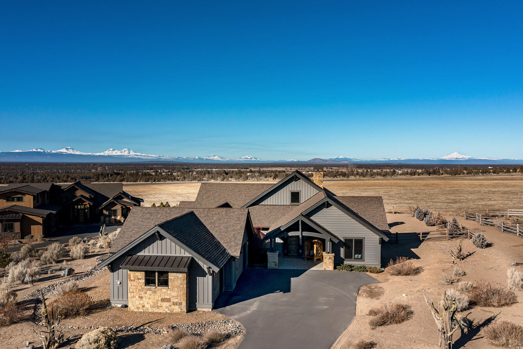 Stunning custom ranch-style home with Cascade Mountain Views. Welcome to this exquisite 2789 sf single-level custom home on a spacious 3/4 acre lot in the sought-after Brasada Ranch community. Designed with upgraded finishes throughout, this 3 bedroom, 3 bathroom home offers an open-concept layout, perfect for modern living. The gourmet kitchen seamlessly flows into the living and dining areas, creating an ideal space for entertaining. Step outside to a fully fenced backyard, where a fire pit surrounded y vibrant summer blooms sets the state for relaxation. Enjoy breathtaking Cascade Mountain views from the comfort of your own home. Experience the exceptional lifestyle that Brasada Ranch has to offer - world-class amenities, stunning natural beauty, and a welcoming community. Don't miss this incredible opportunity.