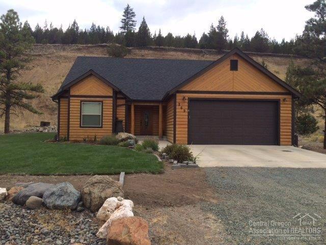 Beautiful Log Sided Canyon City Home! Fabulous Canyon Mt views, open floor plan, recessed lighting, 4 bedroom, 2 bath, carpet & tile flooring, heat pump, Granite counter tops in kitchen and bathrooms, utility room w/sink, pantry, sliding glass door onto concrete patio, landscaped, sprinkler system, retaining wall, composition roof w/rain gutters, attached double car garage. $220,000 #903