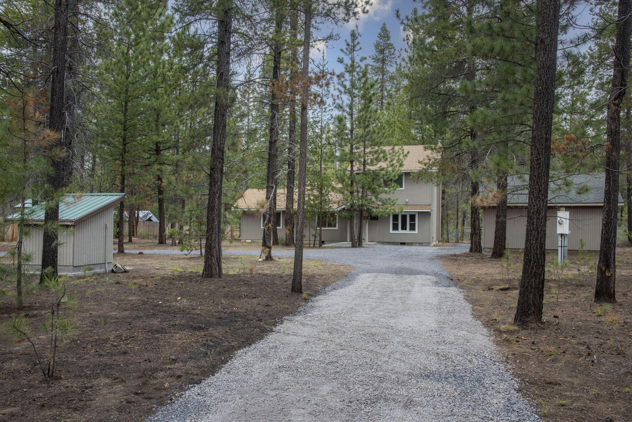 60K Price Adjustment!!! This home is a must see - a cabin in the woods that backs directly to La Pine State Park. The perfect cozy home on a private, level acre, with real hardwood floors, three nice sized bedrooms, primary bedroom on the main level plus kitchen with granite tile countertops. Open dining/living area and bonus family room with wood burning fireplace provides space for everyone to relax and enjoy this special setting. Enjoy peace and quiet from your back porch with your morning coffee, go for a hike on a nearby trail, or head over to the Deschutes River for some fly fishing. Sunriver is just 15 minutes north, La Pine to the south and 30 minutes to Bend. Amenities and outdoor recreation abound - minutes to Quail Run golf course, Mt. Bachelor resort, Paulina Lake, Newberry Crater and more. This home also offers a two car garage, circular driveway and RV/trailer parking. Bring all your toys! Enjoy serenity and all the nearby amenities from this very lightly lived in home.