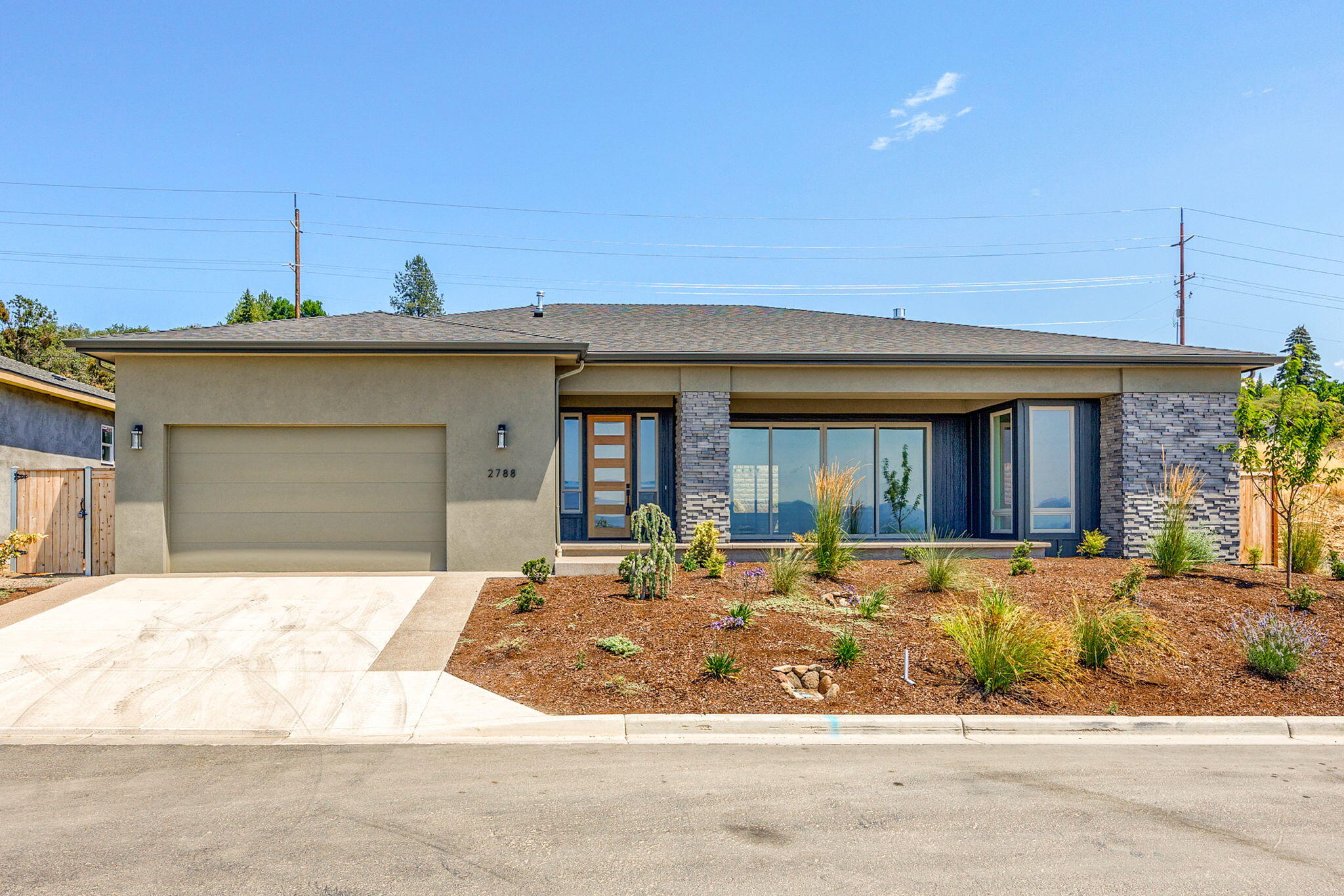 Stunning home in a highly sought-after East Medford neighborhood. This spacious 3-bedroom floor plan boasts 10'' ceilings throughout, creating an open and airy feel. The large primary suite offers a luxurious retreat, and an oversized bedroom with double doors can serve as a versatile flex space. Elegant Luxury Vinyl Plank flooring is laid throughout the home. The bathrooms are designed for comfort, featuring tiled showers, and the primary bath includes a stylish free-standing tub. The gourmet kitchen is a chef's dream w/ a 36'' gas range, plenty of cabinets space. and a walk-in pantry. A large slider door invites abundant natural light and showcases the breathtaking panoramic valley view.  Nestled in Cedar Landing, a vibrant new subdivision, this home offers an array of amenities. The community features over 20 acres of open space and a 5-acre city park with pickleball, basketball, a dog park, and a picnic area. Upon completion, the subdivision will have 2.91 miles of walking trails.