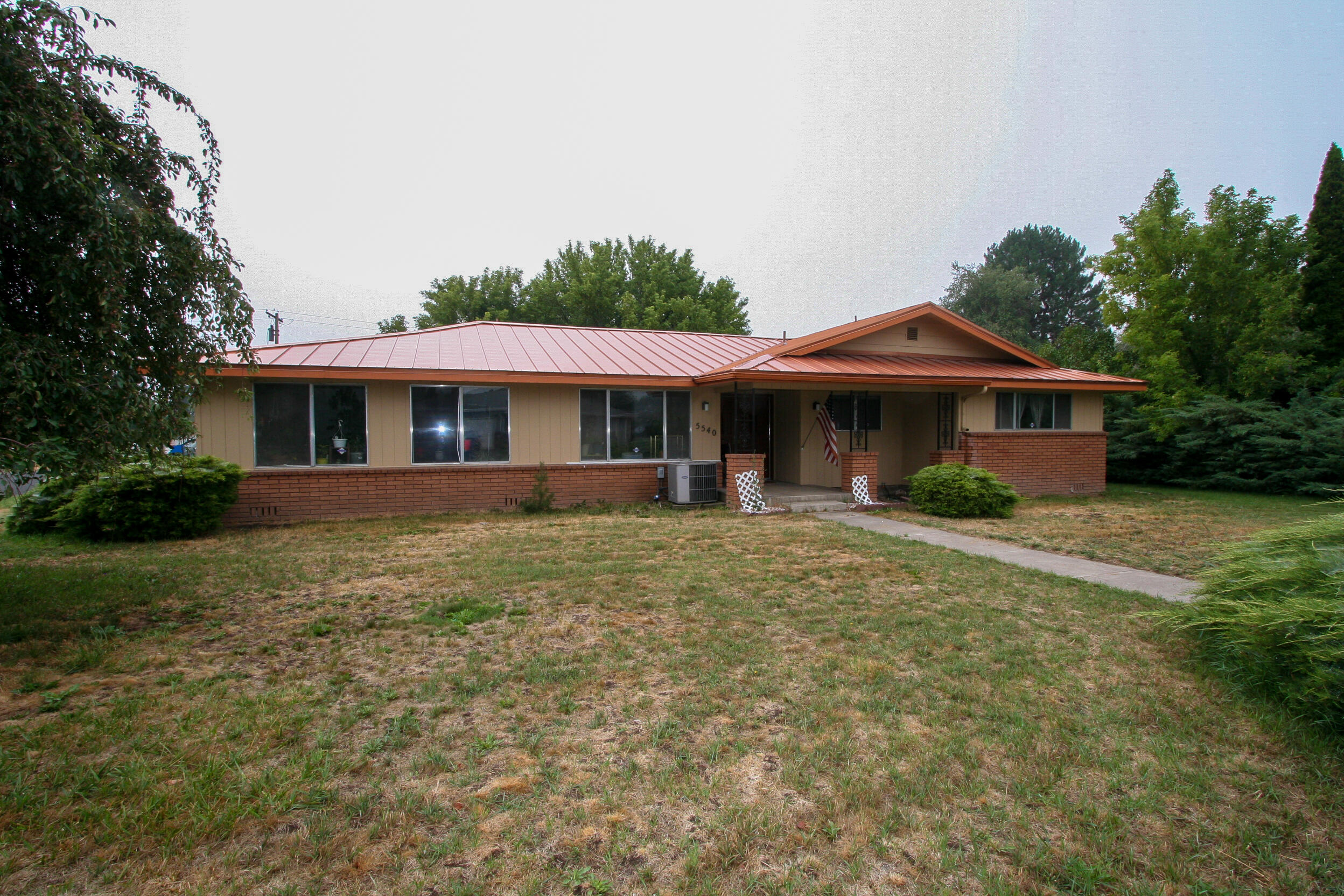 Large rooms and a great layout in this 3 bedroom, 2 bath home.  Large corner lot gives you extra space for an RV or toys.  Large kitchen with pantry.  Extra large bathrooms.  This home feels bigger than its 2180 sq ft.  Furnace is new in 2018.  Metal roof.  Great bones and now you can come in and make it your own.
