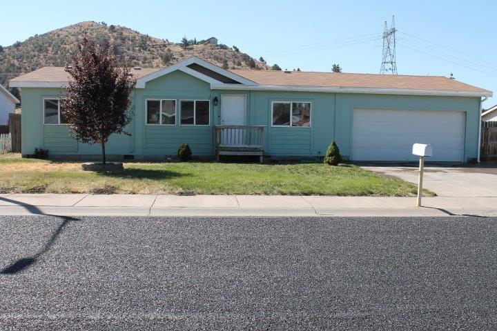 Nice straight forward three bedroom, two bathroom home separated by the living room. Good size fenced back yard, with view of mountain. The front yard is smaller which has sidewalks and paved streets. The home has a two car garage which is deeper than most garages. This is a must see.
