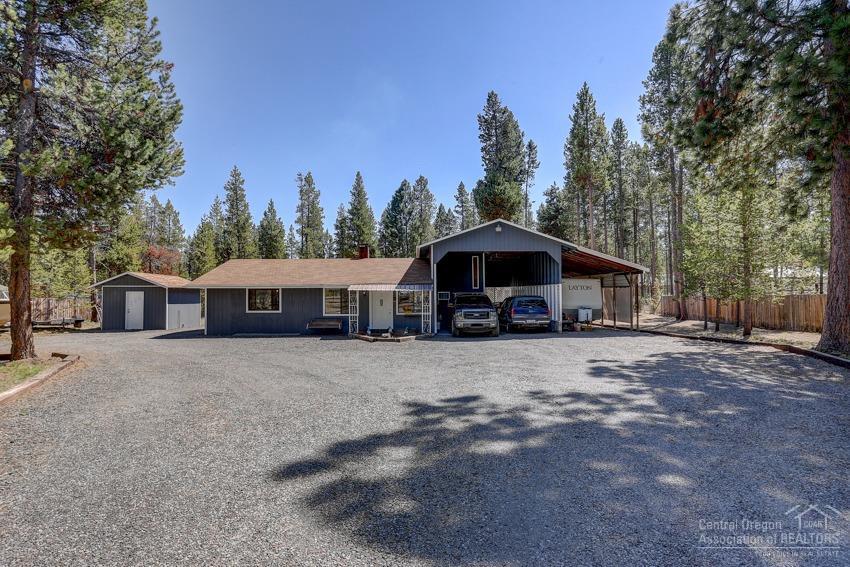 Unique 2 bedroom turnkey Hone on 1.07 Acres in great neighborhood perfect for starter home or vacation property. Updated Home Features Master bedroom on main level plus 2nd loft bedroom with 1/2 bath & private deck, kitchen with eating nook new flooring, paint, updated bathroom, laundry / storage, back patio, electrical & more. Large driveway with attached covered RV & car parking, Storage bldg, Screened in Gazebo, partially fenced yard and 24x34 garage/shop. Private Neighborhood between big & little Deschutes Rivers all in the heart of Skiing, Biking, Fishing, Hiking paradise.
