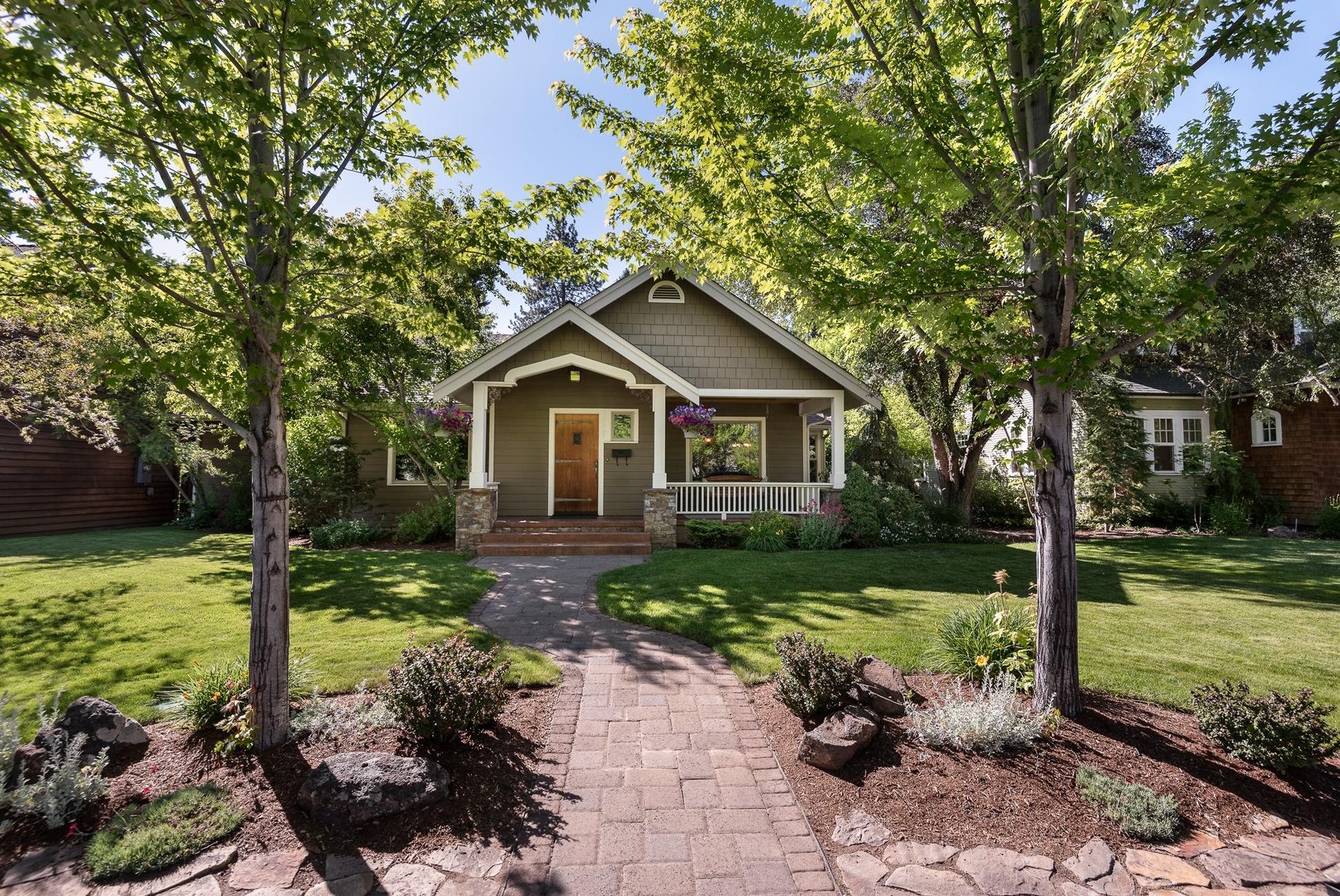 The Historic District in Bend, OR is truly a special place, and this home does it justice. Beautiful curb appeal with mature trees, gardens & even a front porch swing leads inside to a perfect blend of historic, updated & expanded space for the modern lifestyle. Walk into a lovely living room with fireplace & dining room adorned with original glass built-in cabinetry. The kitchen is at the heart of the home w/ island seating & expansive counters. A large family room w/ vaulted ceiling & wet bar leads up to the huge bonus room with walk-in closet. 3 bedrooms, full bath & laundry are in the lower level. Spend the best part of your days in the spacious fenced back yard w/ large paver patio, built-in BBQ, raised garden beds, yard space & even a chicken coop! Parking is the icing on the cake w/ 6 spaces: the 2-car garage, covered RV/boat parking & 3 extra spots on the driveway for your friends. Live the dream by Drake Park, Downtown Bend, Galveston eateries and the lifestyle you deserve.