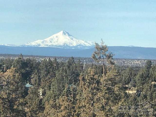 Star gazing, storm watching, & mountain views might take your breath away at times from this lofty perch on a private rock outcropping on 2.74 acres northwest of Redmond. Easy access to shopping & services, but lots of privacy. Numerous updates make this home built in 1972 live much younger. Over 2600 sq ft with a 5+ car attached garage. Dramatic 700 sq ft sunroom is ideal for play, art, guests, entertaining. Huge deck and hot tub, bountiful perennial landscaping. Like being on vacation all the time!