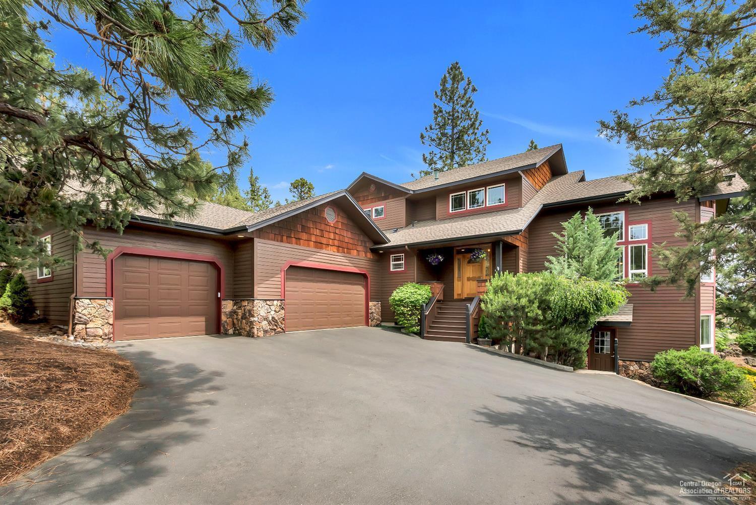 Enjoy City views and privacy from this Awbrey Butte home, which is strategically positioned on a well treed Southern facing 1/2 acre lot. Open Great room concept with high ceilings offer an abundance of windows and natural light which reveal city views, all of which is framed by a canopy of mature ponderosa pines from this elevated 1/2 acre home site. The large home office doubles as a 4th BR, and a studio apartment opportunity exist with private, separate access from the ground floor. The Mstr. BR is conveniently located on the main floor with access to a deck, and a bonus room is upstairs. Privacy abounds in the back yard with a tranquil cascading water fall feature and a private patio. Neighborhood tennis courts are just a few minutes walk from this home, and the terrific West side location of this home allow for direct, immediate access into downtown Bend. This home also offers a large 3 car garage to accommodate the outdoor toys so prevalent in Central Oregon. This is a great home