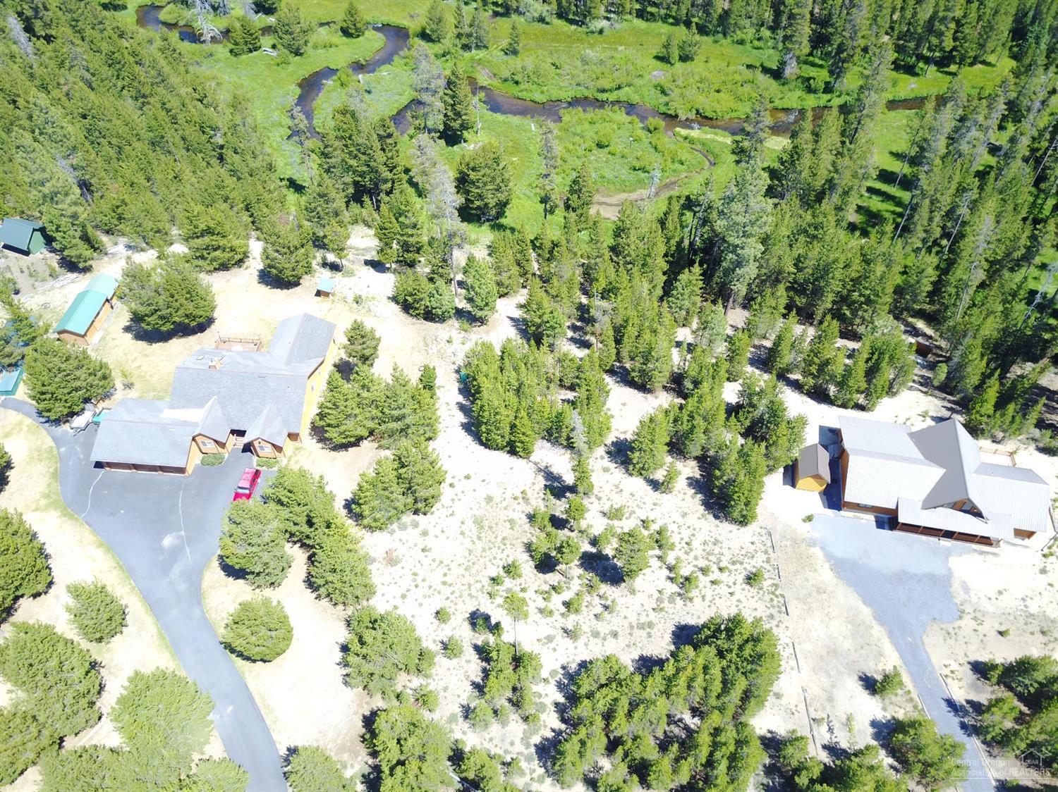 Little Deschutes Riverfront property! EXCELLENT building site or just RV. Remove a few trees and have a fantastic view of the river. Less than a block from forestland! Seller is willing to carry with reasonable down and terms!
