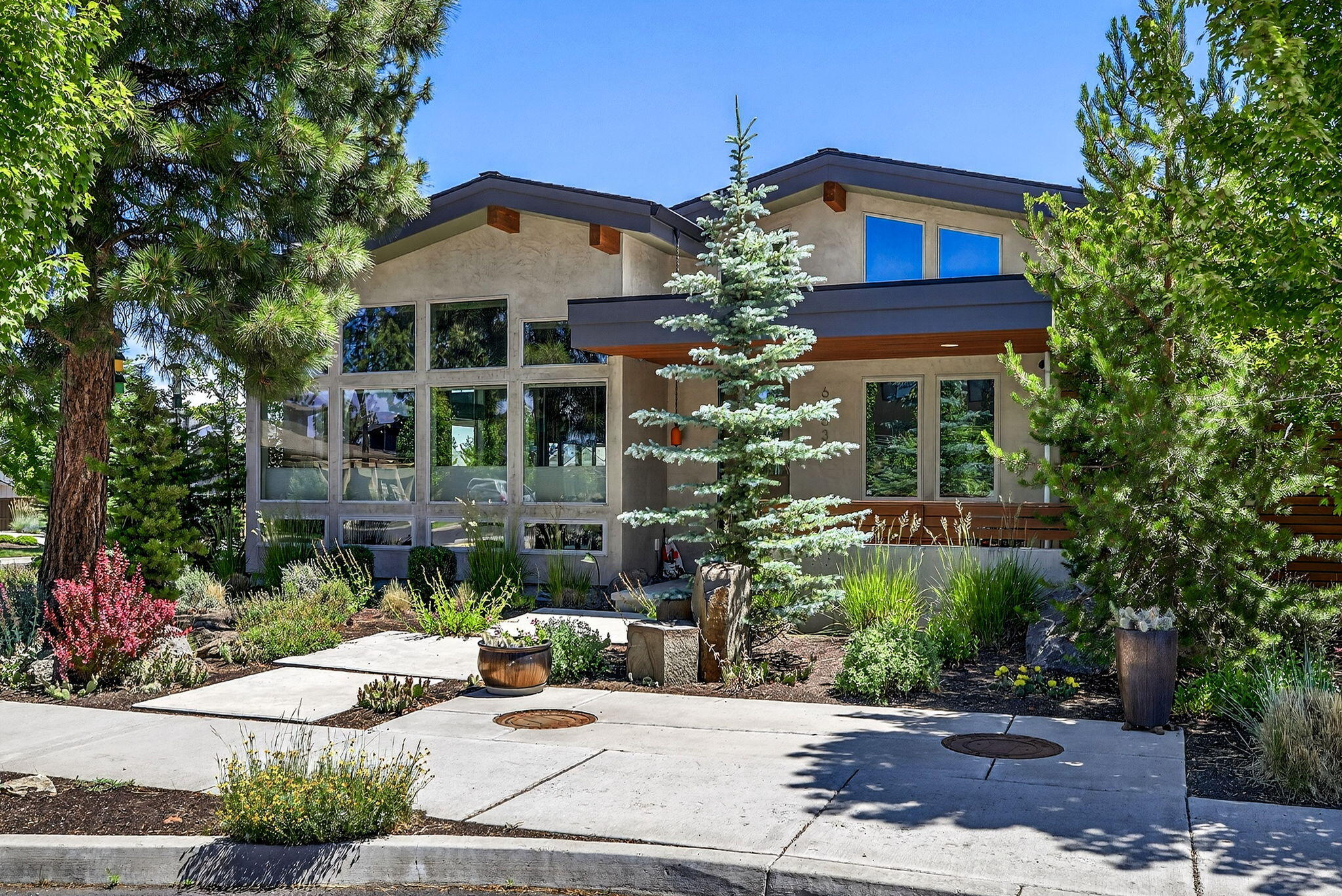 Imagine waking up to mountain views from your private patio. This single-story home on Bend's westside makes it a reality. Located on a prime corner lot, this residence is all about easy, luxurious living. The bright, open floor plan features a vaulted great room that is perfect for gathering with friends and family. The chef's kitchen is a dream for anyone who loves to cook and entertain, while a dedicated office offers a quiet space to focus. The three-car garage, including an RV bay, means you'll never have to worry about storage for your adventure gear. Outside, the low-maintenance yard gives you more time to explore the nearby trails and enjoy all that Bend has to offer. The side yard is a great bonus, ready to be fenced for a dog run. This home isn't just a place to live-it's your gateway to the active, vibrant lifestyle you've always wanted.