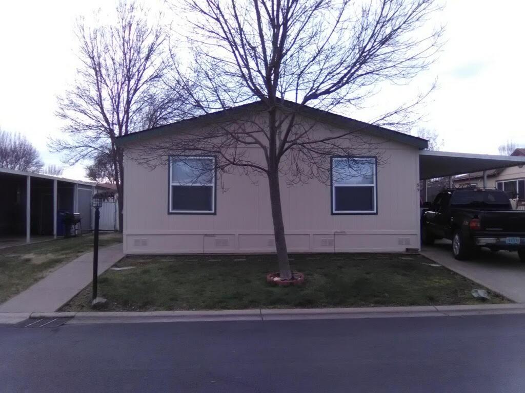 Well maintained split floor plan with 1296 sq ft. In Butte Crest Park. Upgrades include bathroom with cultured marble and newer faucets. Kitchen has newer refrigerator, sink, faucets. The roof was replaced about 6 years ago. Amenities in the park include: Club house with exercise room and a game room with small playground. Sale of home also includes washer / dryer and refrigerator. Seller will include a 1 year home warranty with a full price offer.