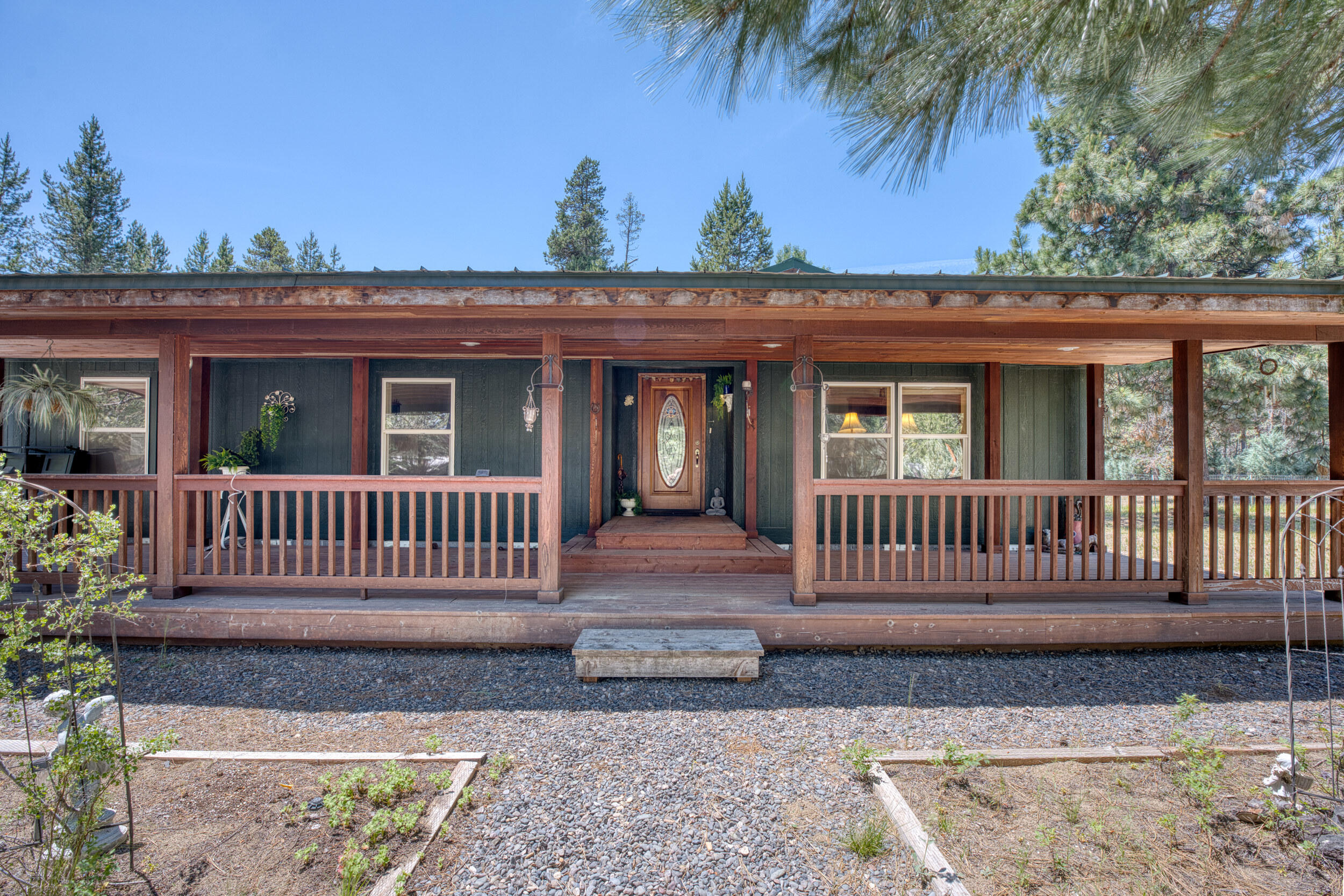 Welcome to the Ranch! Spacious and full of potential! This spacious and well thought-out manufactured home with an attached garage, is nestled on a beautiful lot and offers a fantastic
opportunity to create your dream Central Oregon retreat. Enjoy a bright and open floor plan with generous living spaces, perfect for entertaining or simply relaxing. Step
outside onto the large covered back deck or sit on your covered front porch to take in the peaceful surroundings located minutes away from La Pine State Park.
The property features a private well, a large fenced yard, detached 1080 sq ft shop installed in 2011 provides ample space for storage, projects, or all your toys. With plenty
of room to grow, this home is a great investment in a serene La Pine setting.