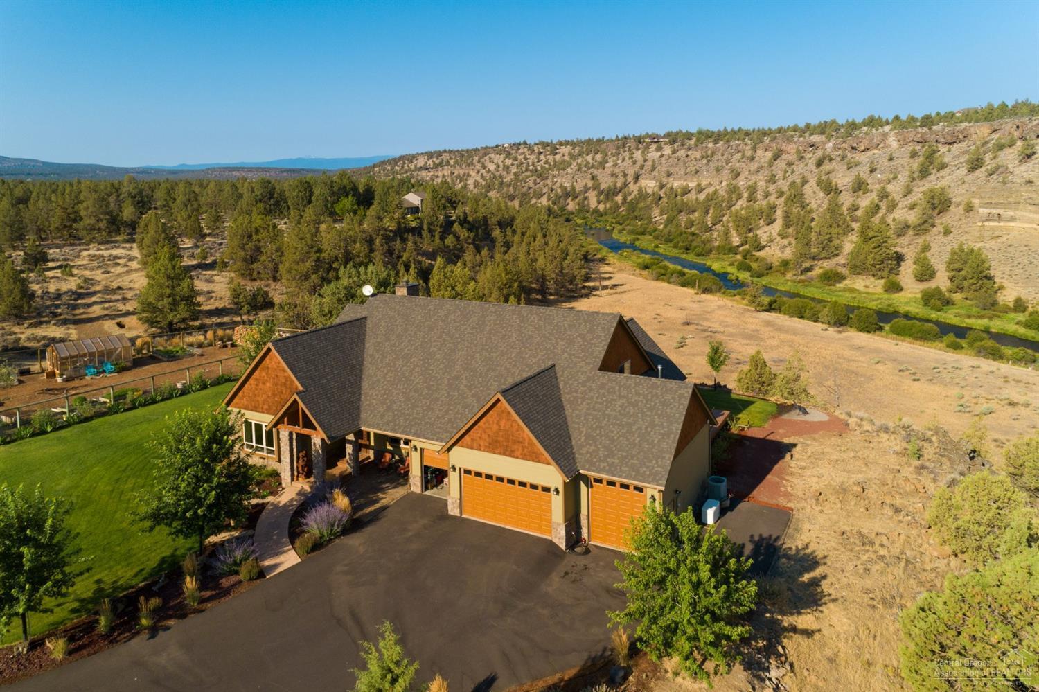 Rare River Front Property. Find serenity in this captivating 3122 SqFt Estate located in Redmond. Open concept and attention to detail finishes offer Hickory Cabinets, Alder Floors, Stone Fireplace, tongue and groove vaulted Great Room and many more details making this home warm and inviting. Rare opportunity to own two sides of the Deschutes River with Off the Grid Potential. Recreation and relaxation meet at this scenic and enchanting property. A true River Runs Through It
