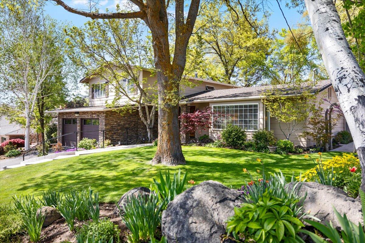Discover the epitome of tranquility in this exquisite one-owner residence nestled in the heart of the scenic Hot Springs Area. Boasting 3 bedrooms and 2.5 baths, this corner lot gem offers privacy with a serene private backyard and meticulously maintained landscaping including a relaxing water feature. Entertain effortlessly in the recently remodeled custom kitchen, unwind in the luxurious primary bath, and enjoy ample storage with a spacious walk-in closet. Welcome home to comfort, style, and unparalleled beauty.