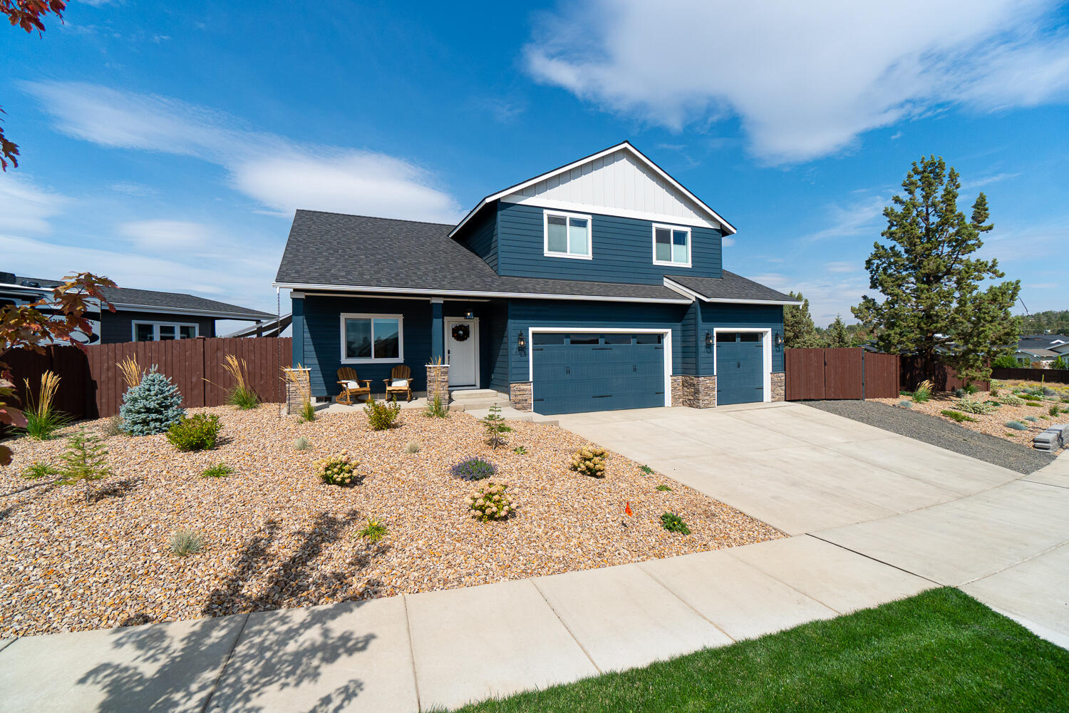 Immaculate home on Bend side of Redmond with Cascade mtn views! Largest lot in neighborhood! Many custom upgrades! Front porch has tongue and groove ceiling. Large foyer welcomes you with shiplap walls and ceiling. Office and half-bath off foyer. Great room has gas  fireplace with ceiling height stonework. Open kitchen features ceiling height custom wood cabinets, beautiful quartz counter tops, large kitchen island, pantry, stainless appliances, farm sink. Spacious master bdrm has walk out patio, en suite with private water room and large walk-in closet. Upstairs boasts 3 bdrms, bath with two sinks, large media/bonus room with wet bar and cedar deck.  High quality laminate flooring and custom top-down-bottom-up cellular shades throughout. Expansive backyard patio with natural gas hookup.  3 car garage with vaulted ceilings. Fenced and landscaped yard with auto sprinklers, gated dog run, trailer/RV parking. 50A whole house generator hookup. Outlets in soffits for Christmas lights.