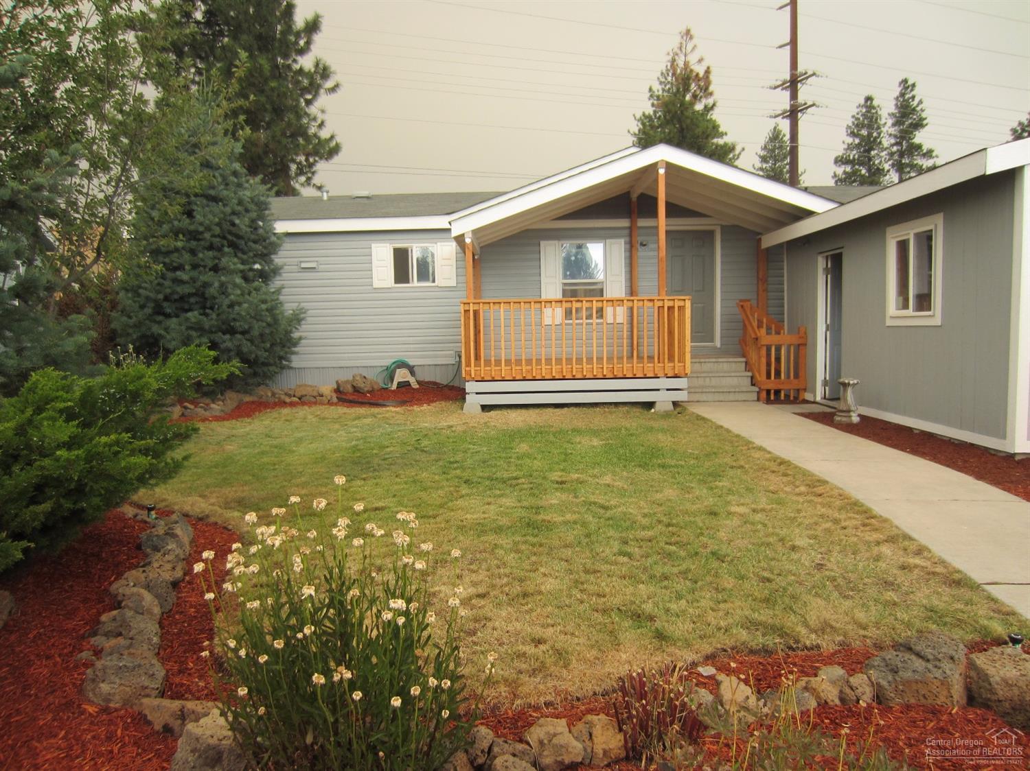 WOW! This home has been rehabbed from top to bottom. All brand new: int/ext paint, high quality carpet/pad & laminate floors, faucets, light fixtures, appliances including fridge w/H20&ice, ceiling fans, toilets, blinds. Mstr has walk in shower & soaker tub. Big .22 acre fenced lot w/storage building and double car garage. New sprinkler system. Great location. Golfside is a wonderfully maintained newer mobile park.The land is leased at 411.46/month.
