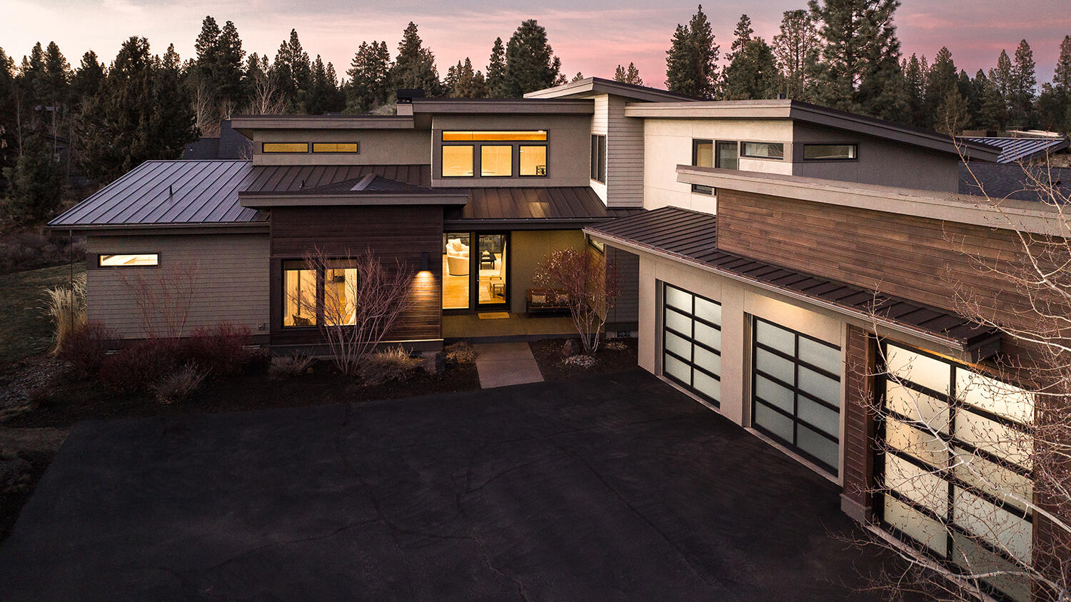Modern NW Living in Tetherow. This thoughtful floorplan offers 4 Bedrooms, 4 Full Bathrooms, a Dedicated Office, Bonus Room and a Beautiful Outdoor Entertaining Space. The architecture of this property highlights Natural Light and Lot Privacy, with an Open Floorplan with Vaulted Ceilings.  The Kitchen features an oversized Island, Jenn Air Appliances and opens to the Great Room and Dining Room.  Main Level Primary Suite with Bathroom, Walk In Closet and Private access to Outdoor and Screened Hot Tub. Oversized 3 Car Garage with 12' Ceilings provides great storage, and the 3rd Bay is 10' in Door Height. Upstairs, 2 Bedrooms, 2 Bathrooms and a Bonus Room provide a separate and functional space.  High Quality Build features Staggered Stud Construction, and a Metal Roof with Full Membrane lining.  Situated on a .38 acre homesite that offers privacy, backs to community common space and is located on a quiet cul de sac.